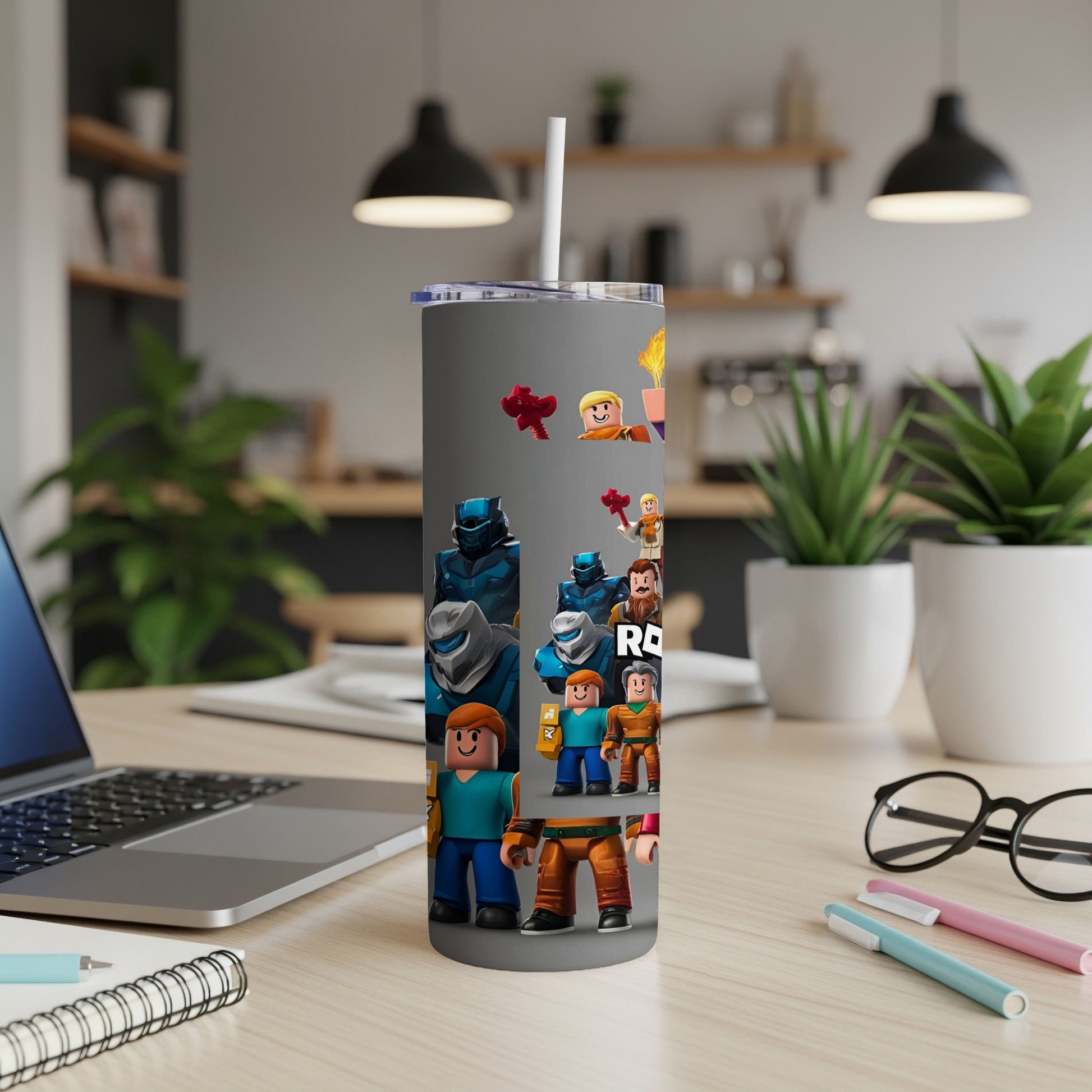 Roblox characters on a gray tumbler with a straw.