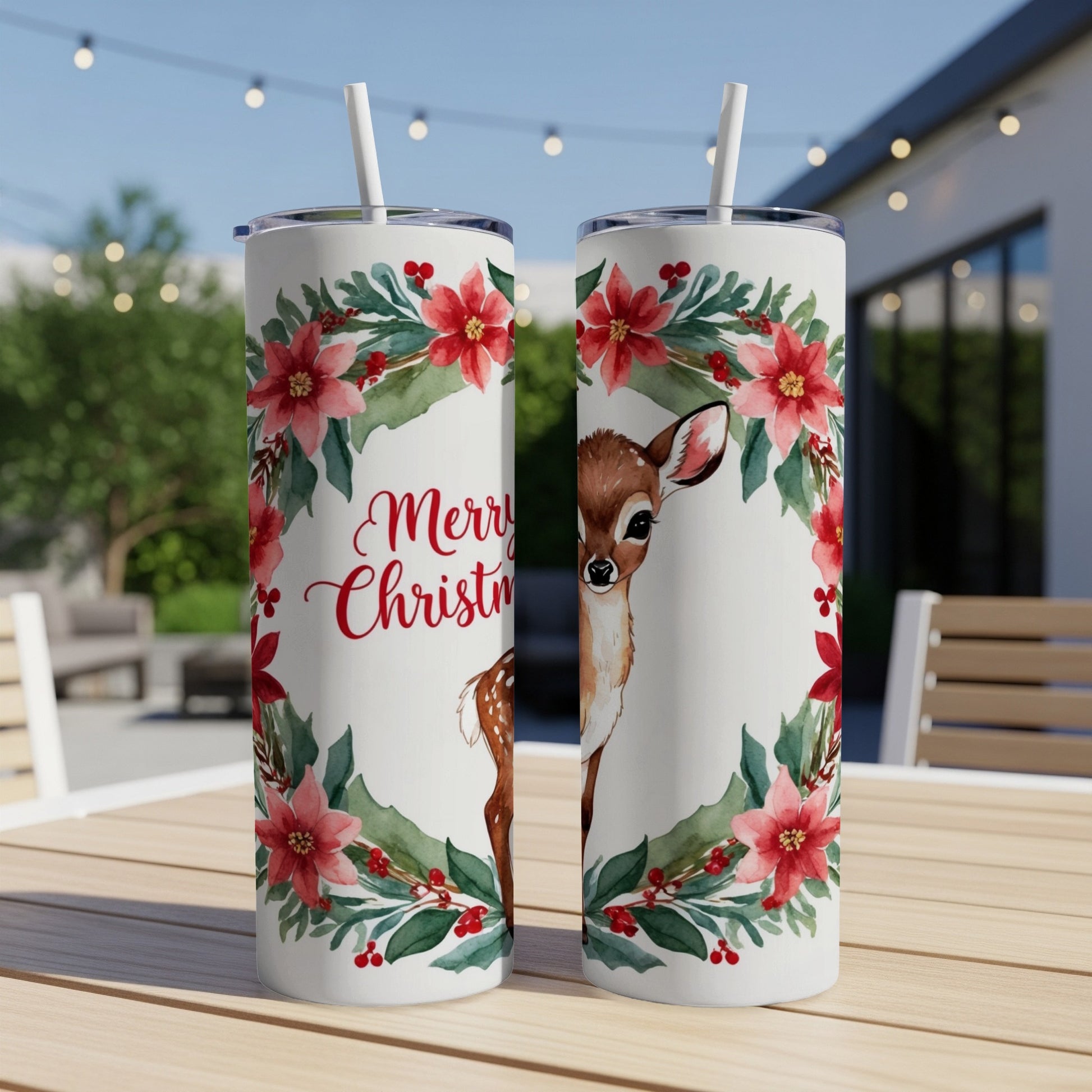 White tumblers with festive floral wreaths, a deer, and "Merry Christmas" text.
