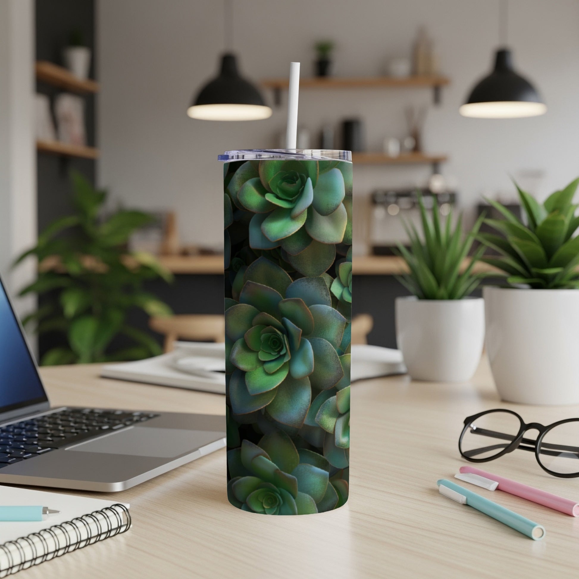 Green succulent pattern on a white tumbler with a straw.