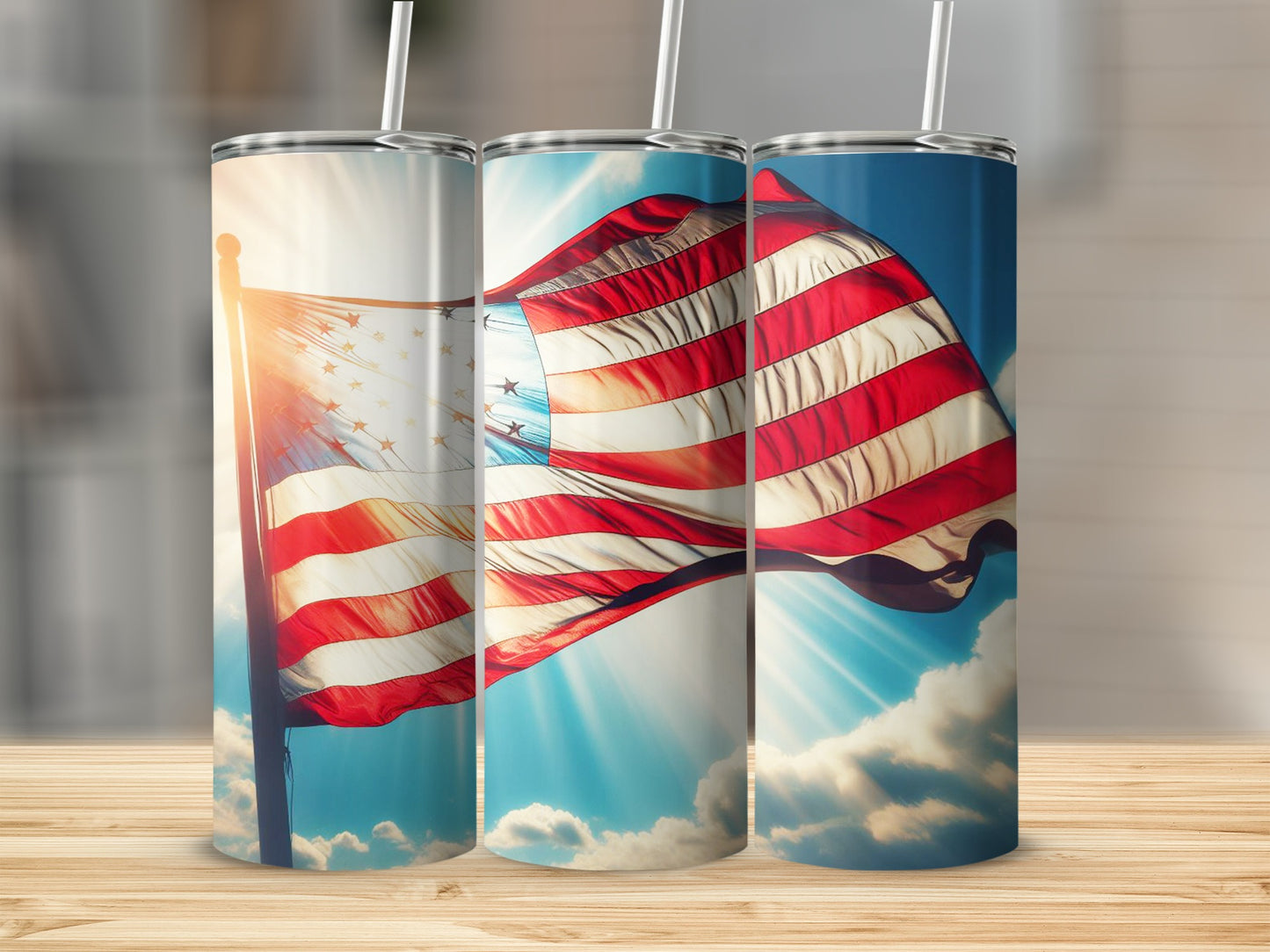 Three tumblers featuring an American flag against a bright sky and clouds.