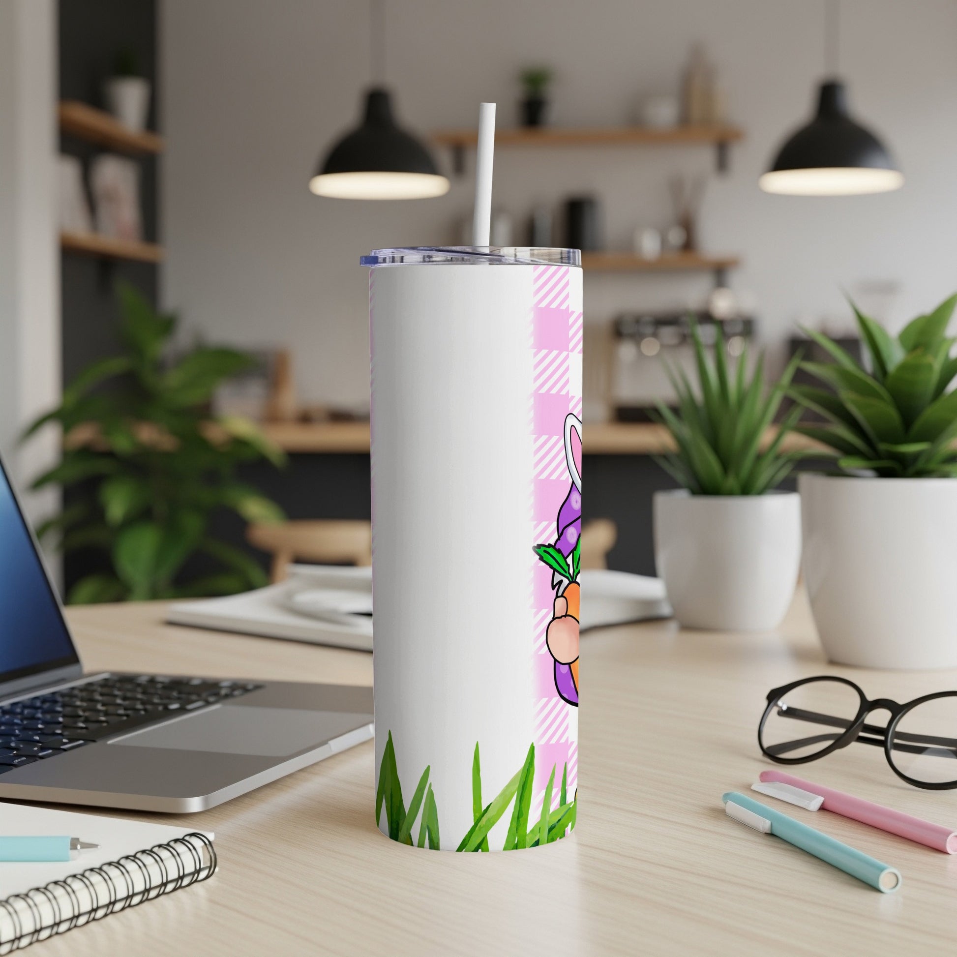 White tumbler with Easter bunny and carrot design on pink plaid.