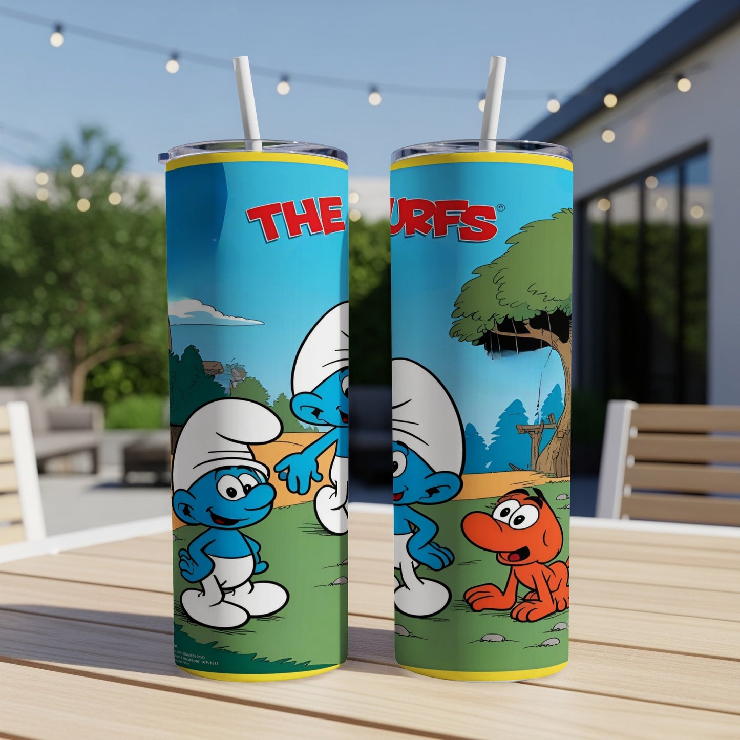 The Smurfs characters Papa Smurf and Smurfette on a blue, yellow, and green tumbler.