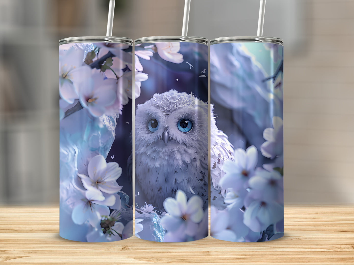 White owl with blue eyes among cherry blossoms on a set of three tumblers.