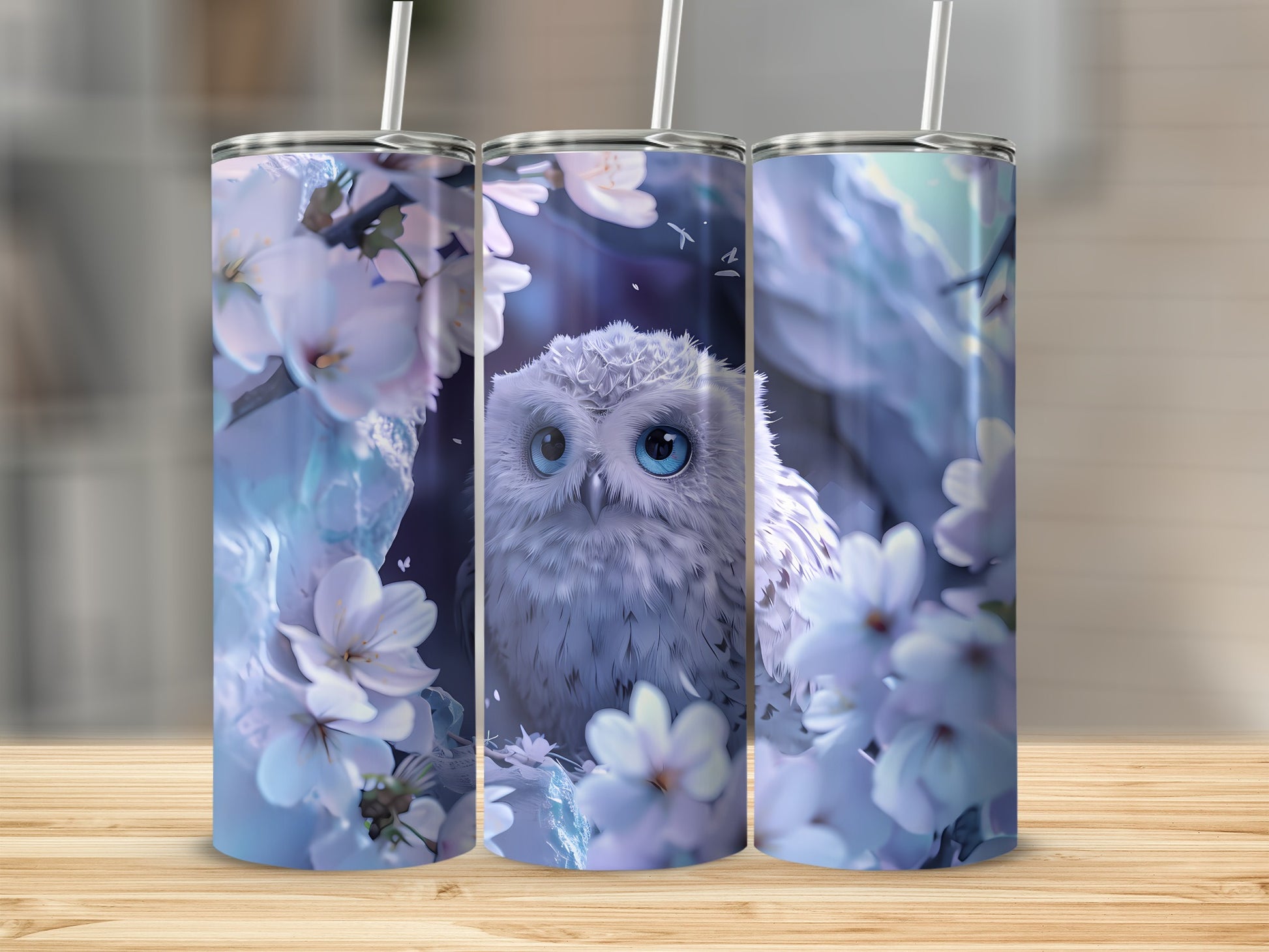 White owl with blue eyes among cherry blossoms on a set of three tumblers.