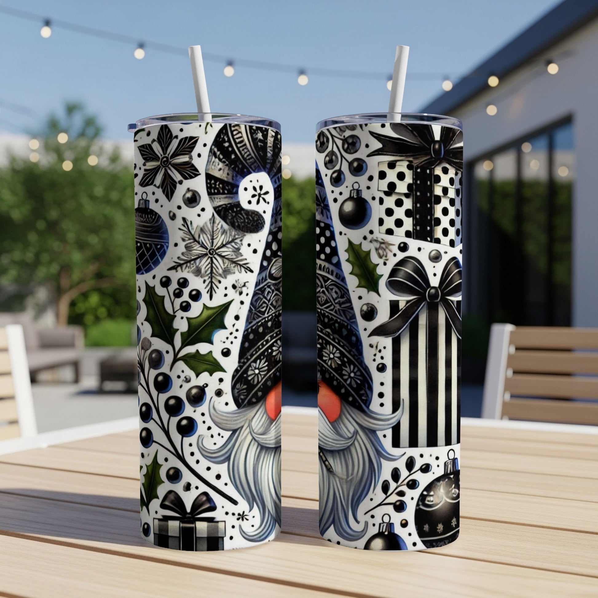Two tumblers with black and white holiday gnome and gift designs.