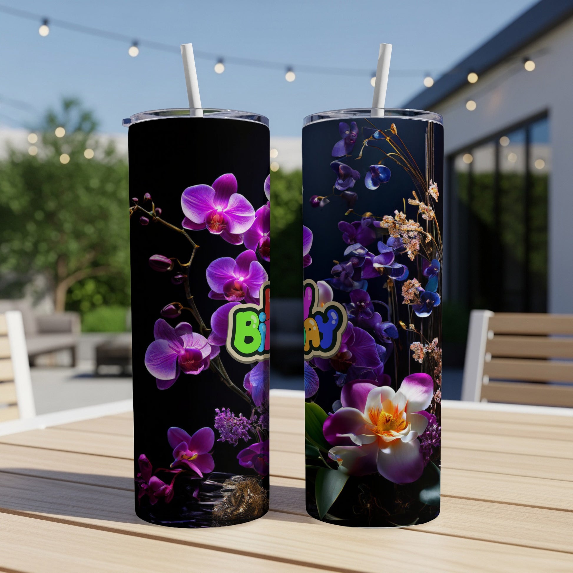 Birthday orchid floral pattern on two black tumblers with straws.