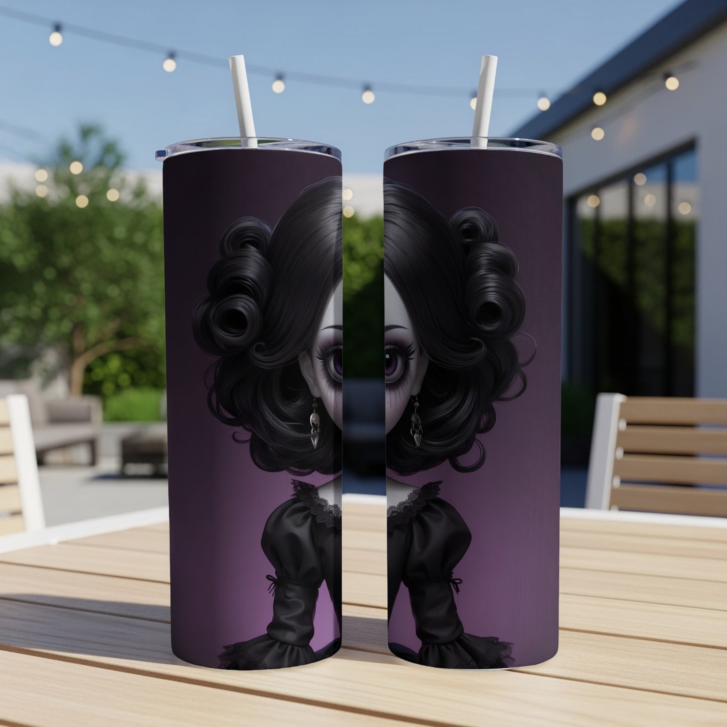 Two purple tumblers with gothic doll illustration on a wooden table.