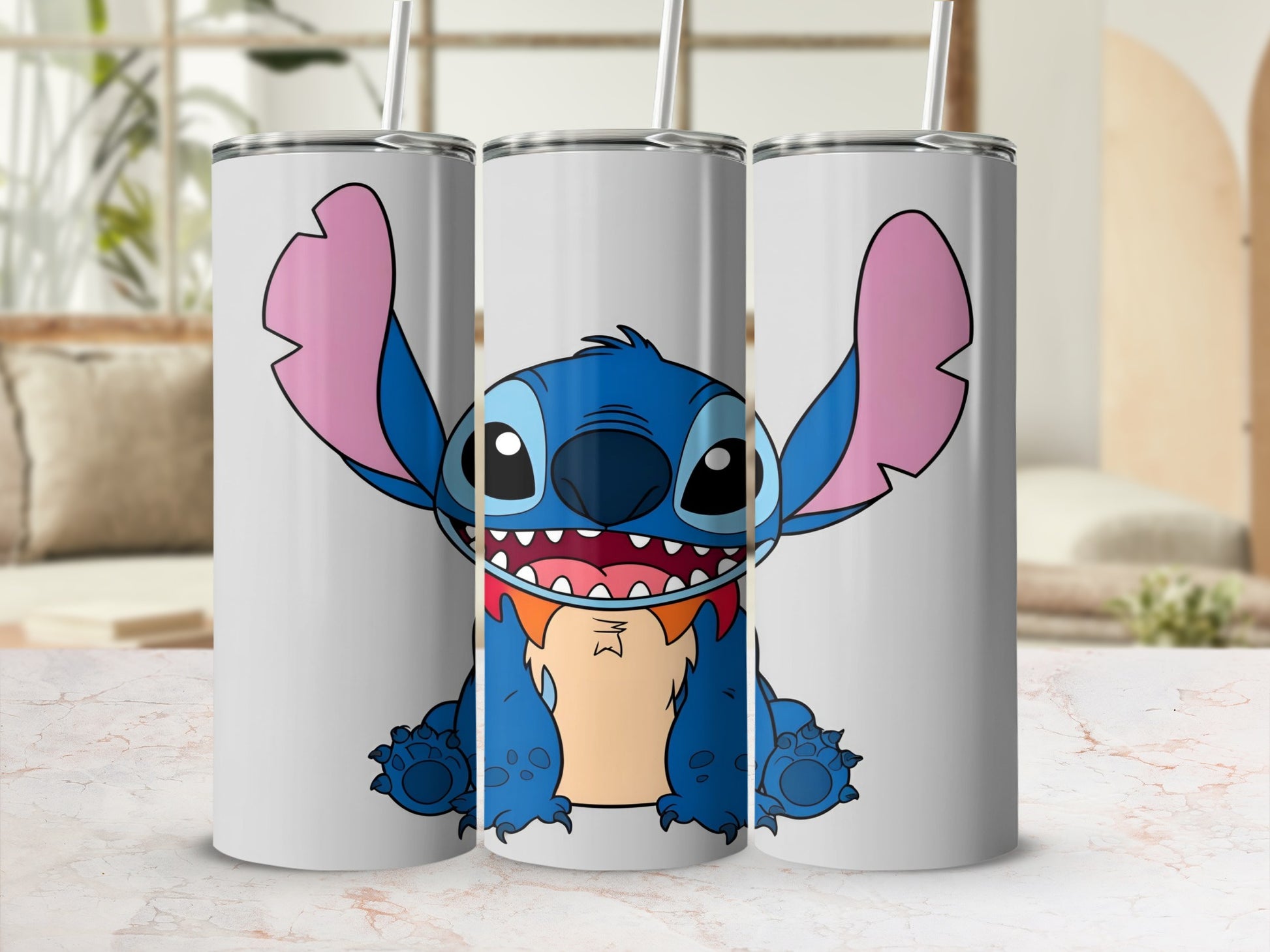 Stitch character on three white tumblers with straws.