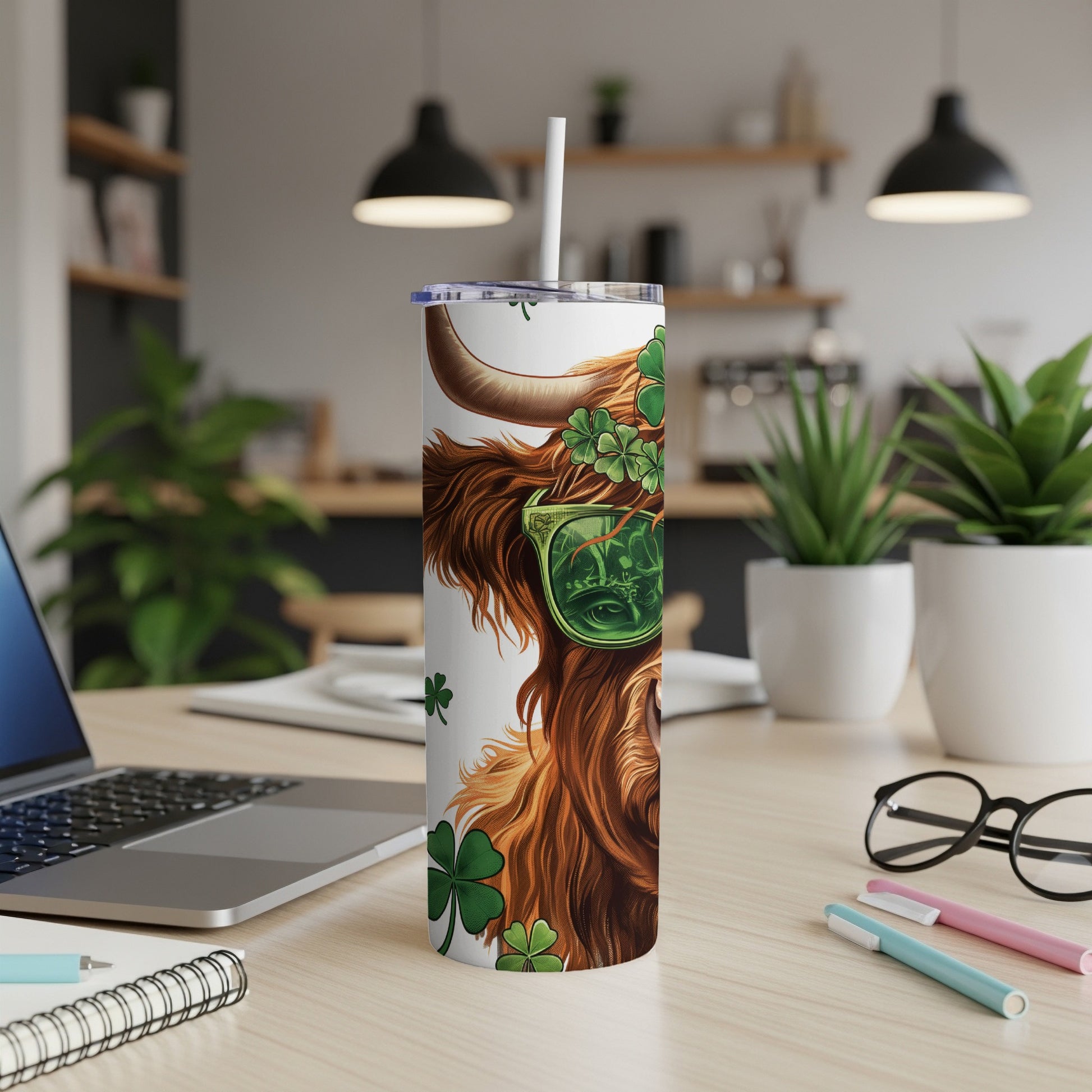 Highland cow with sunglasses and shamrocks on a white tumbler.