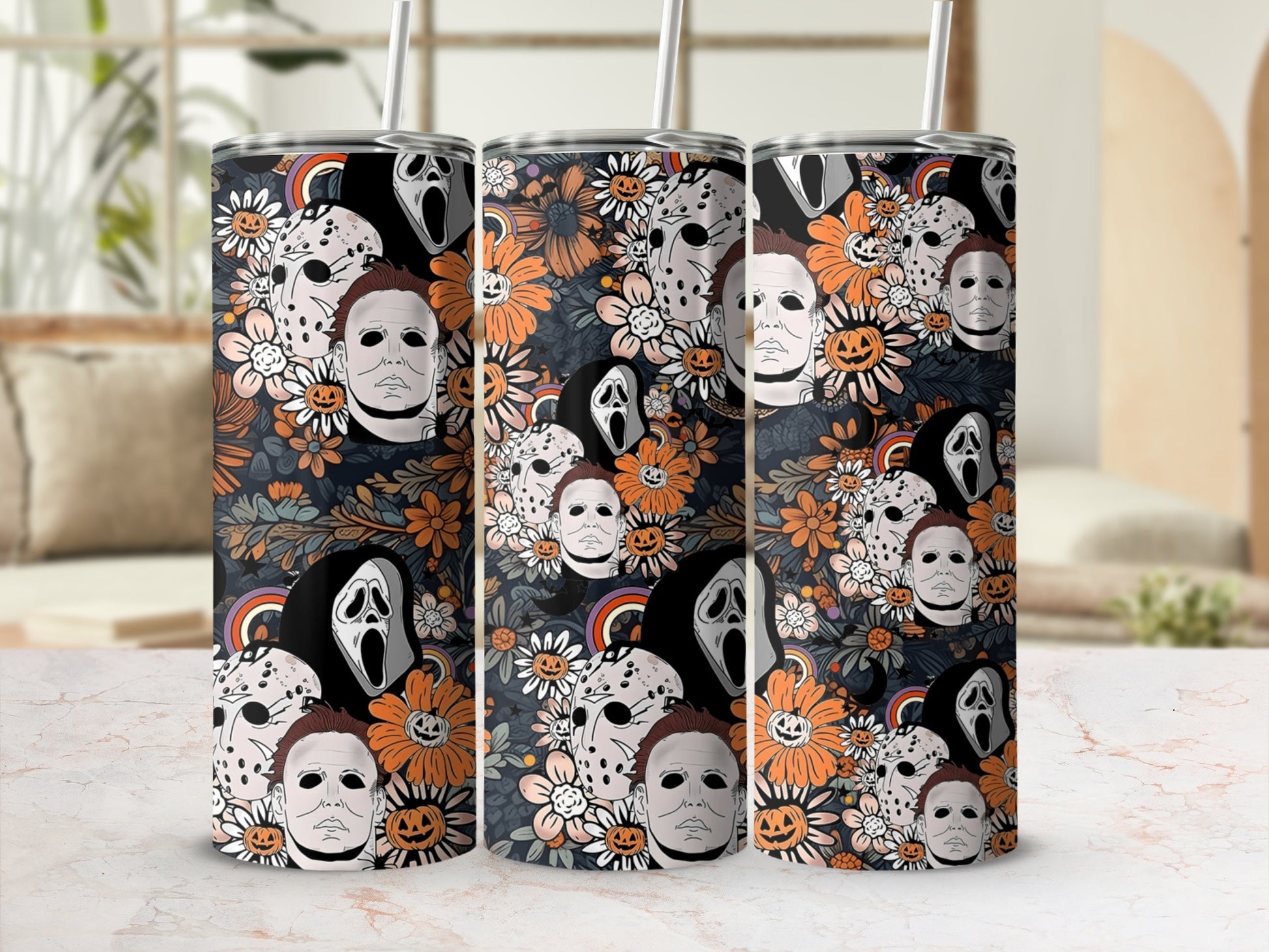 Horror movie masks and pumpkins on a floral background tumbler with straw.
