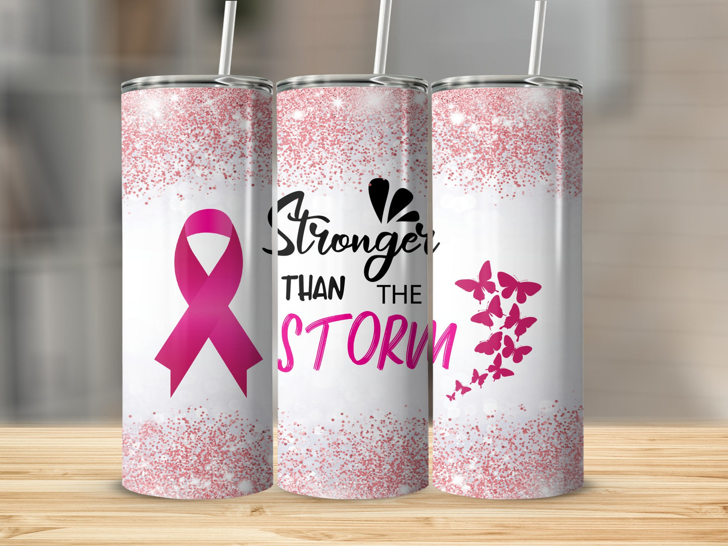Pink ribbon and butterflies on a tumbler with "Stronger Than the Storm" text.
