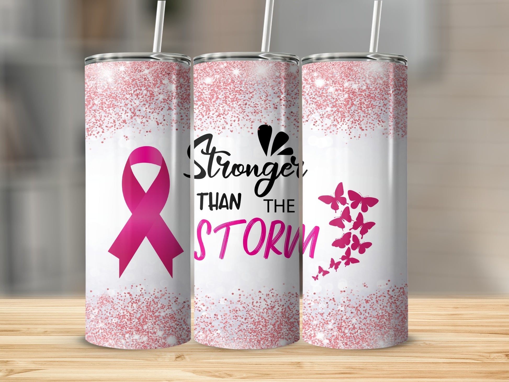 Pink ribbon and butterflies on a tumbler with "Stronger Than the Storm" text.