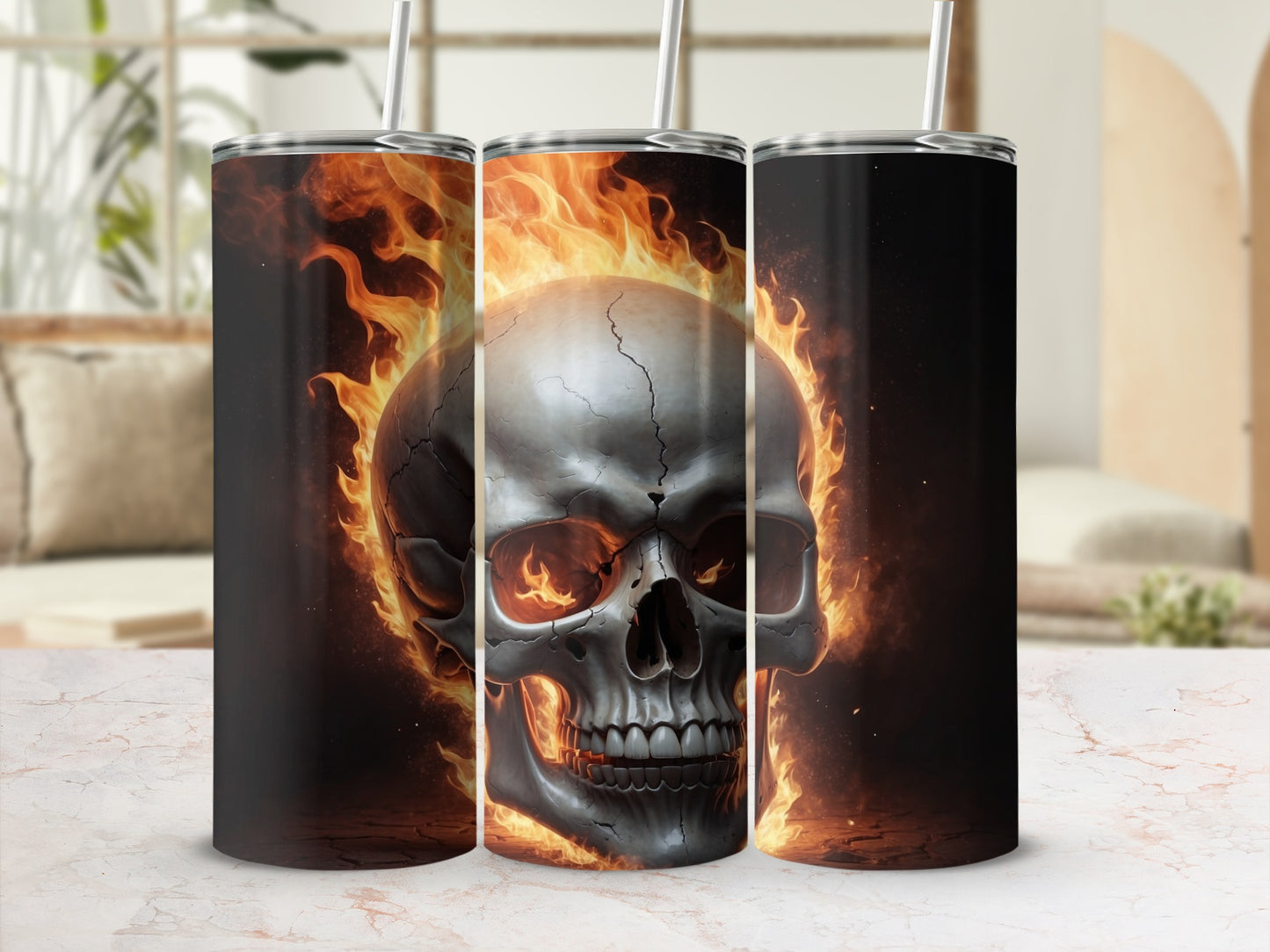 Triptych of tumblers with a flaming skull design.