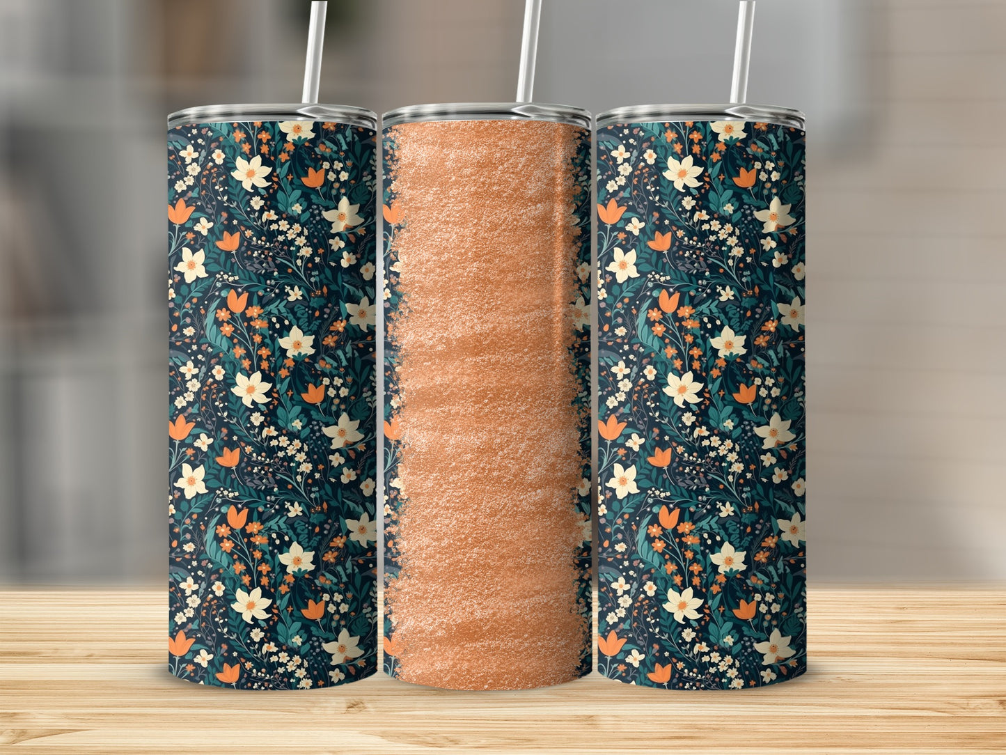 Dark blue tumbler with orange and white floral pattern, and a second tumbler with textured orange.