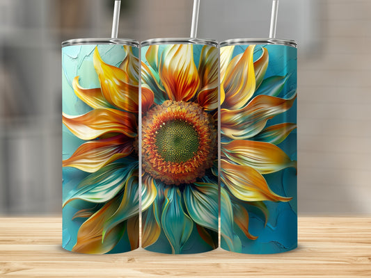 Three tumblers with a detailed sunflower design, against a blurred background.