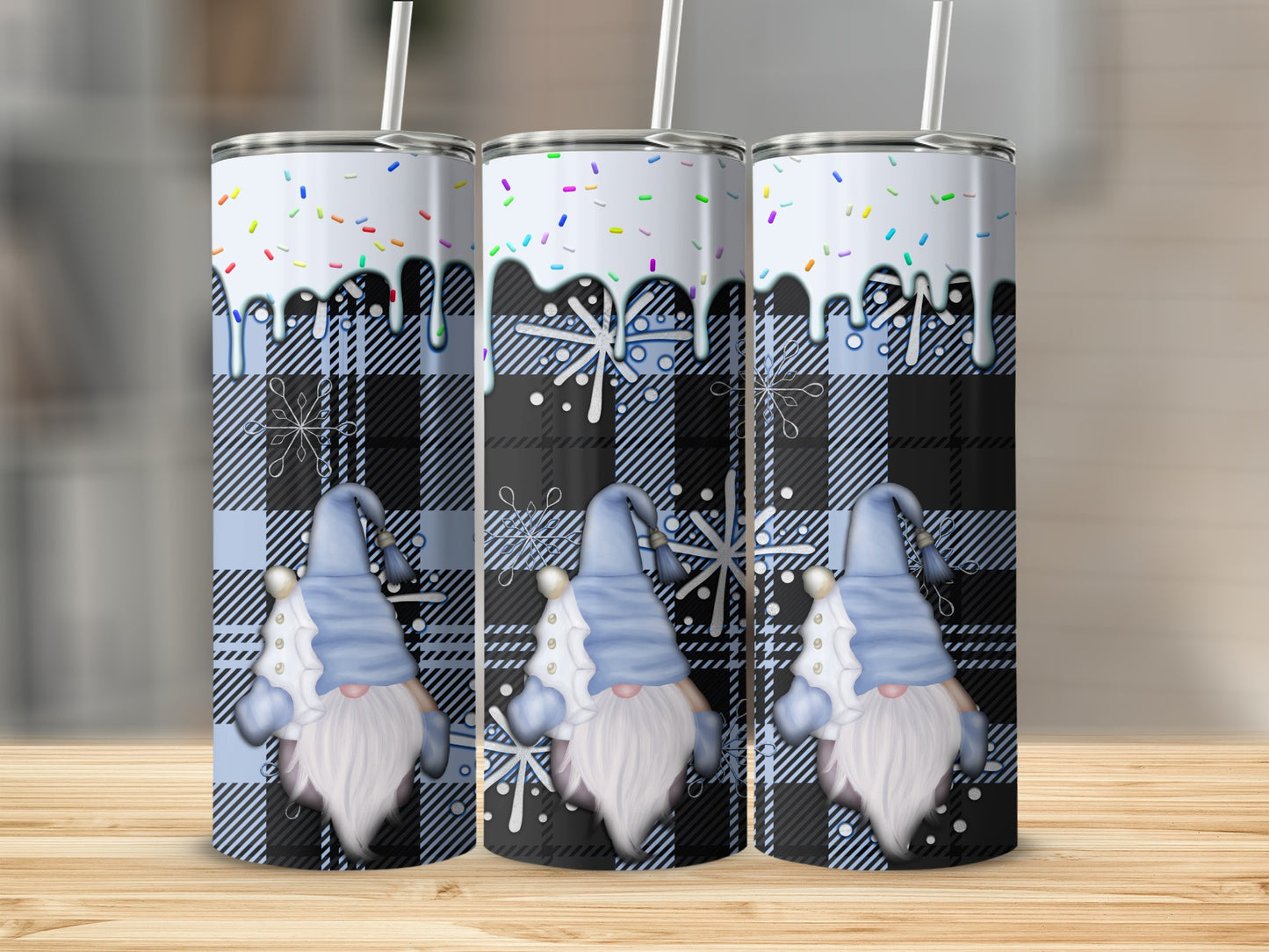 Three blue plaid gnomes with white beards and snowflake designs on tumblers.