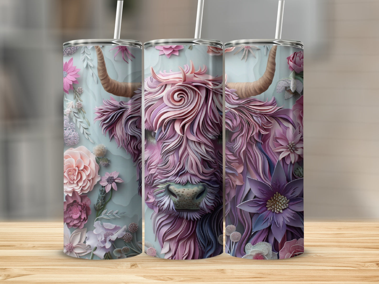 Pink Highland cow with floral accents on a set of three tumblers.