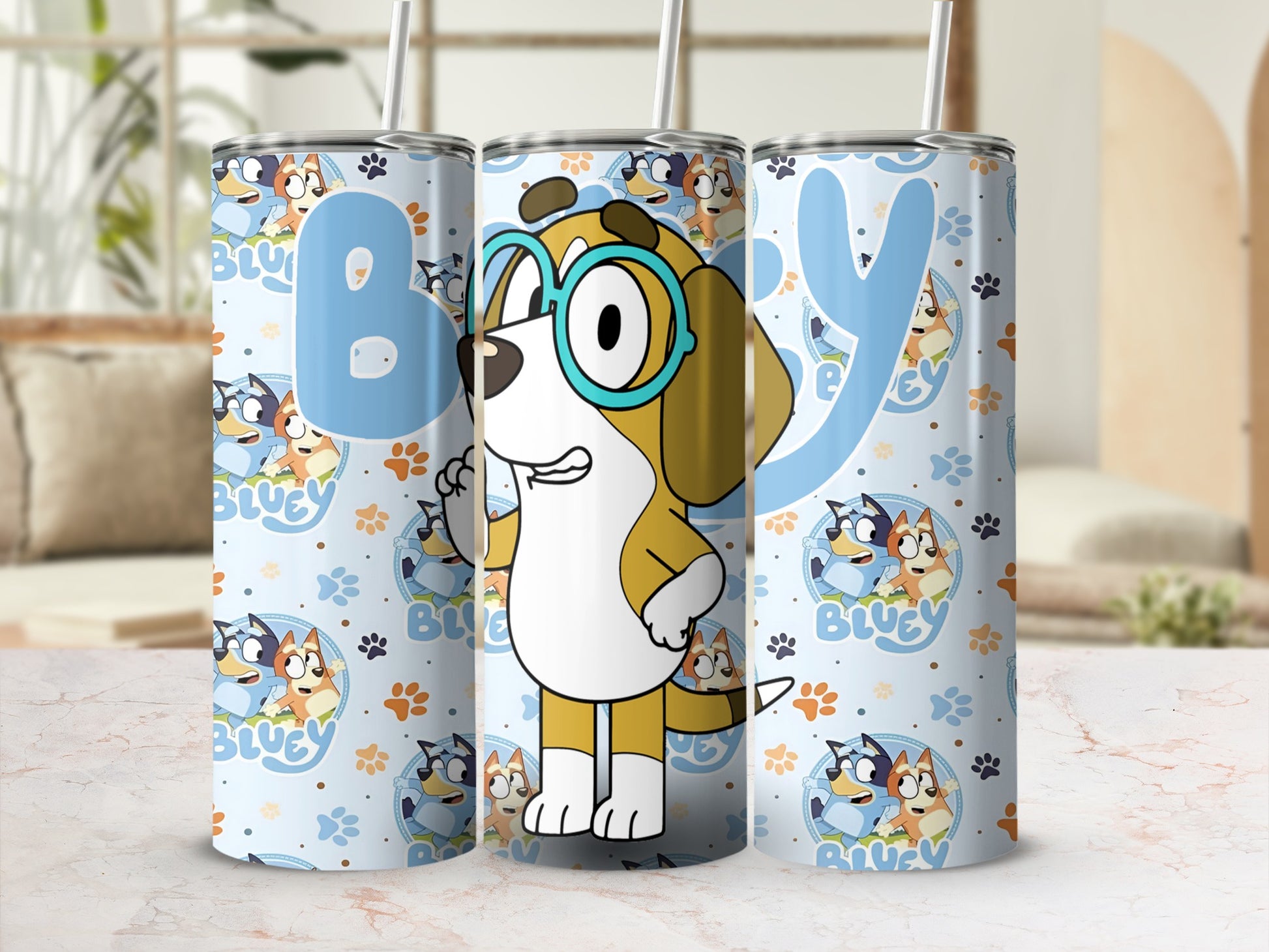 Bluey the dog with glasses on a light blue tumbler with paw prints.