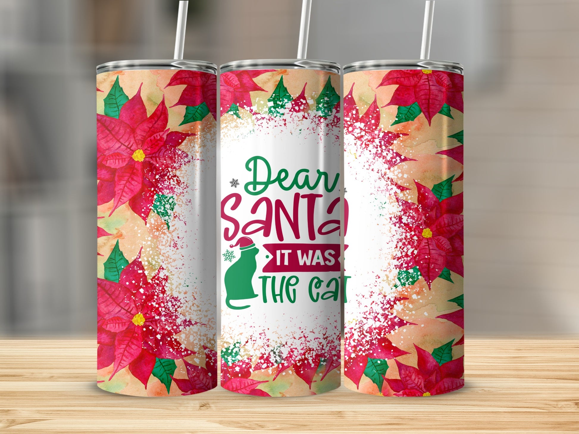 Three tumblers with poinsettia and "Dear Santa it was the cat" text.