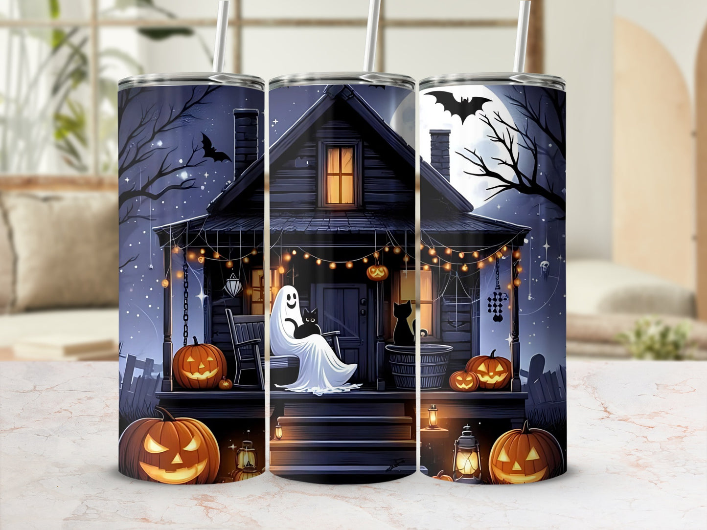 Halloween tumbler with a haunted house, ghost, black cats, bats, and jack-o'-lanterns.