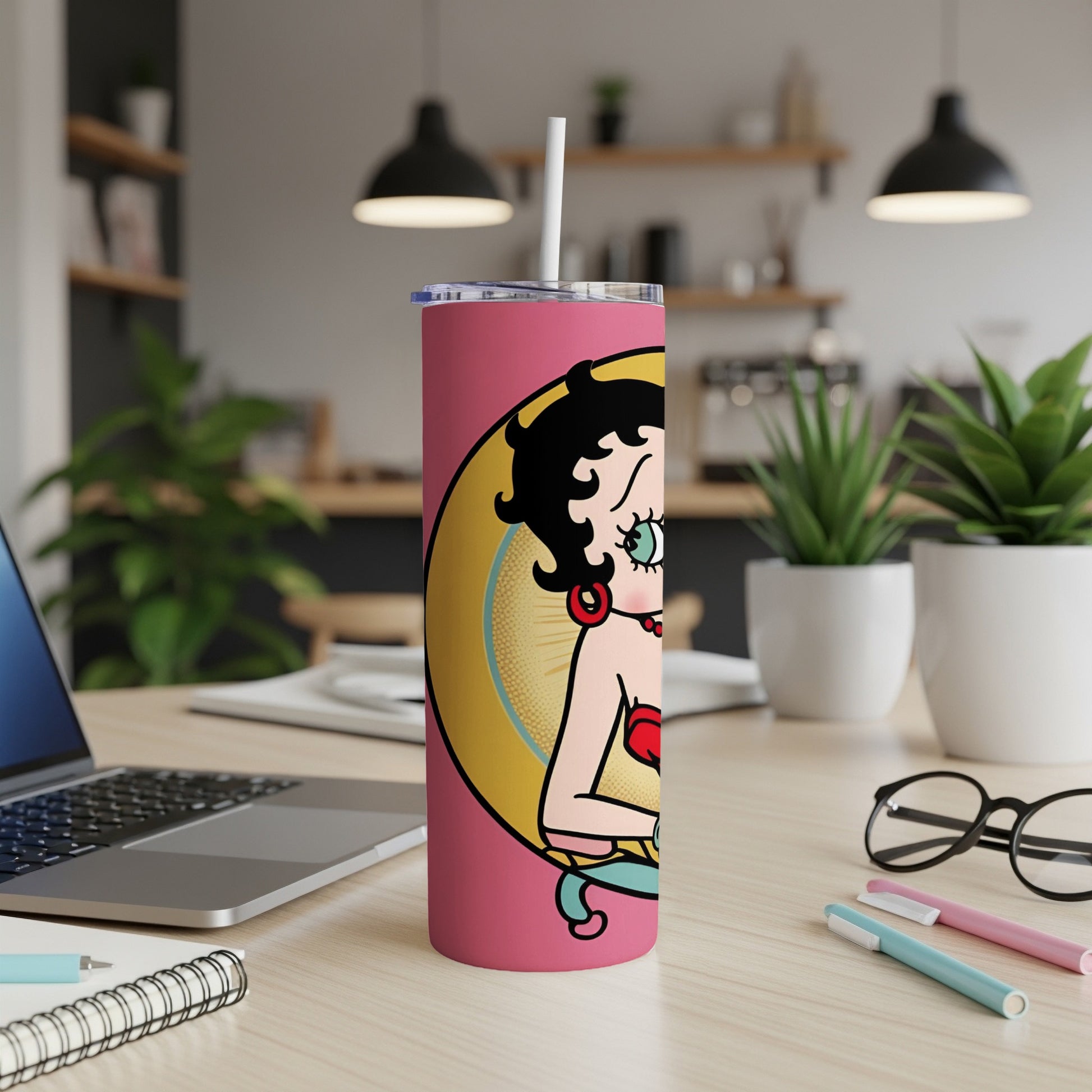 Betty Boop on a pink tumbler with a straw.