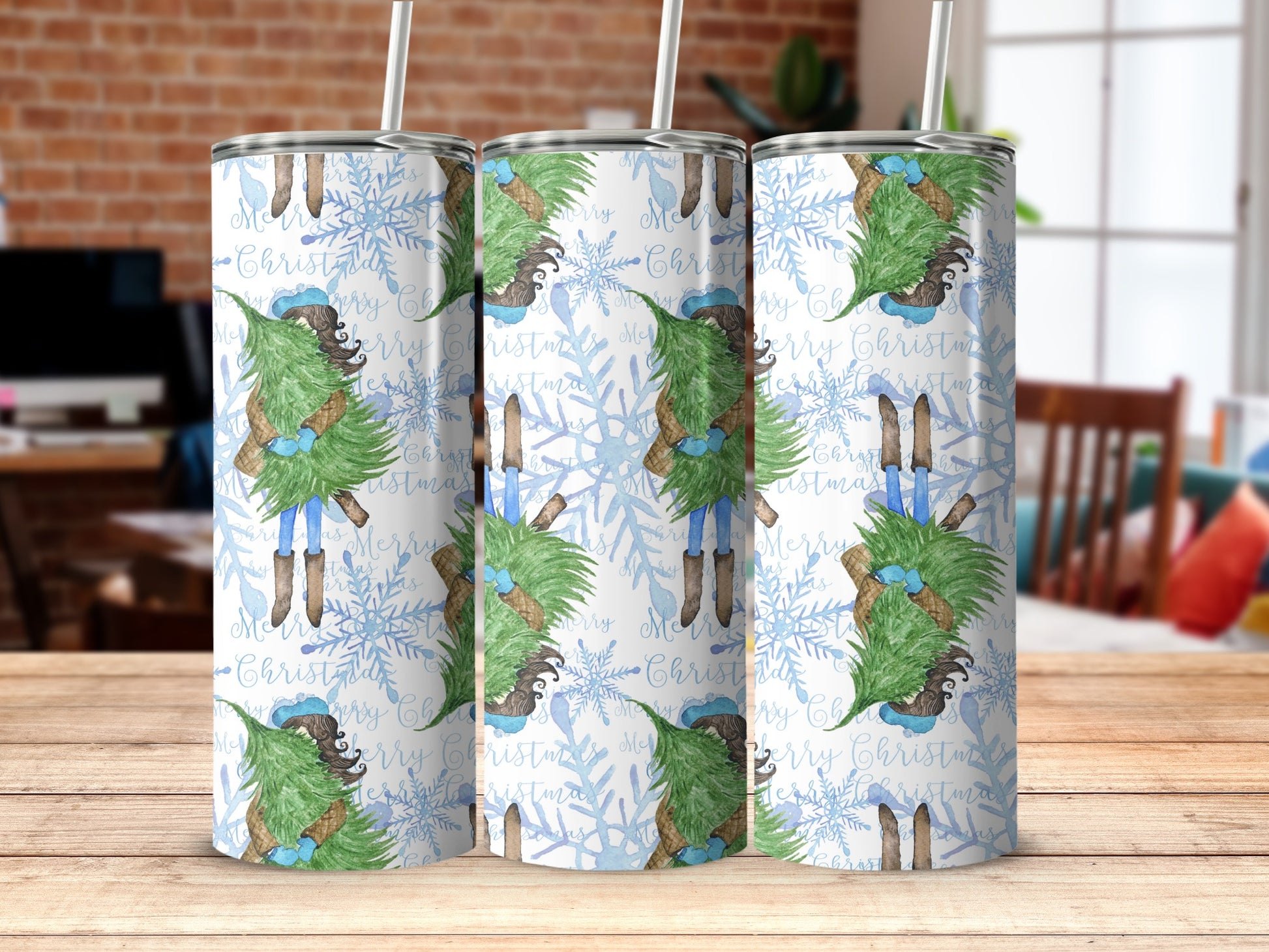 Christmas tree tumbler with snowflakes and "Merry Christmas" text.