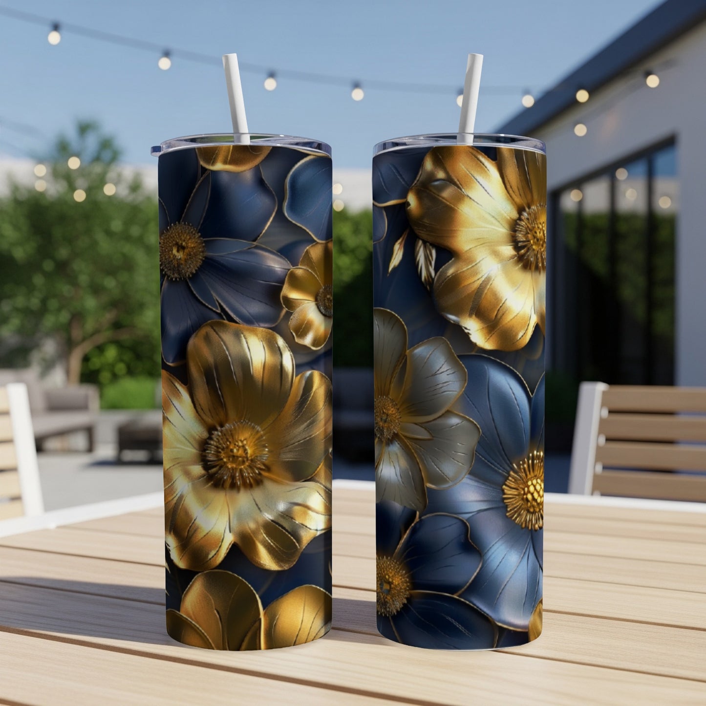 Two tall tumblers with a metallic floral design on a wooden table.