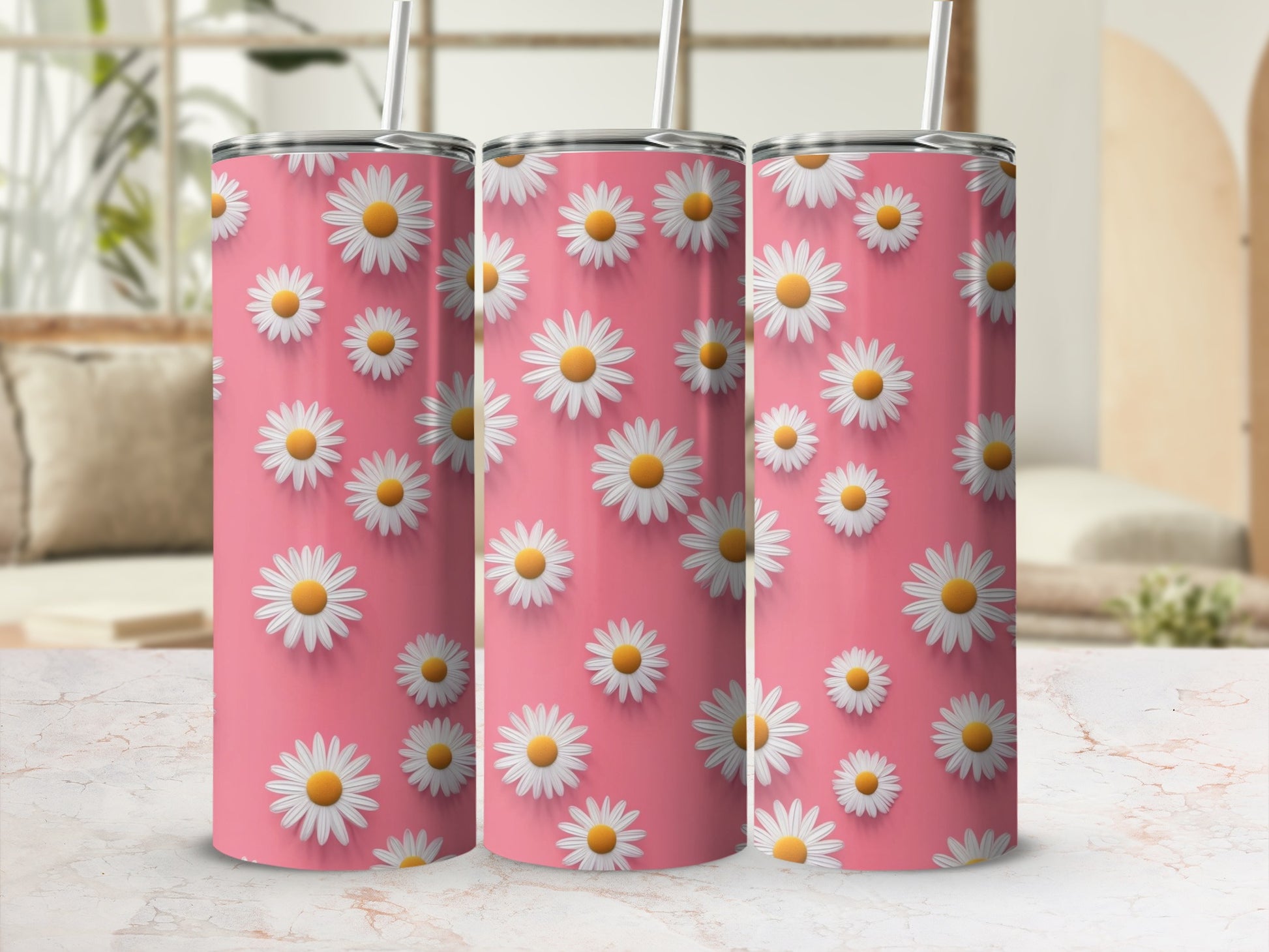 Pink tumbler with repeating white daisy pattern and straw.