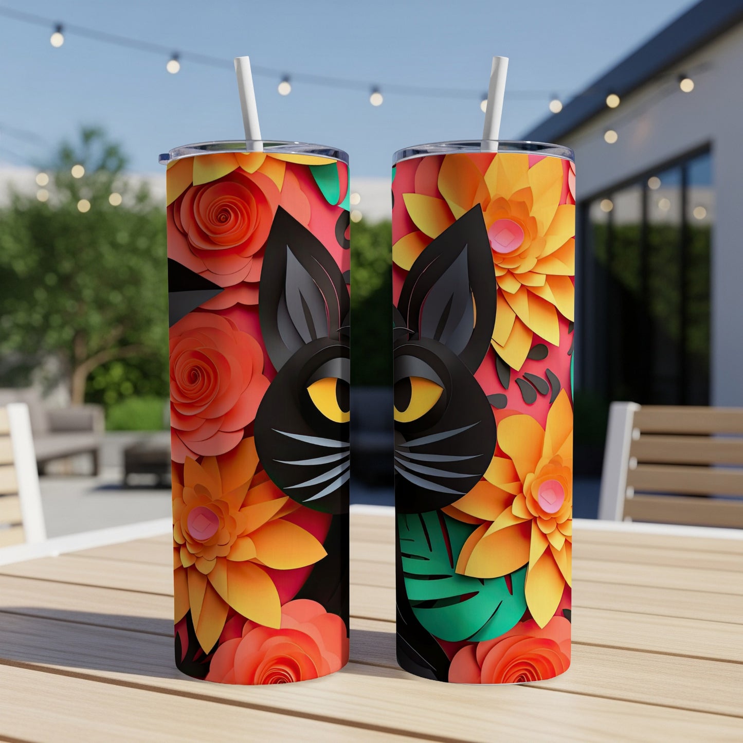 Two tumblers with a black cat face and floral paper cutout design.