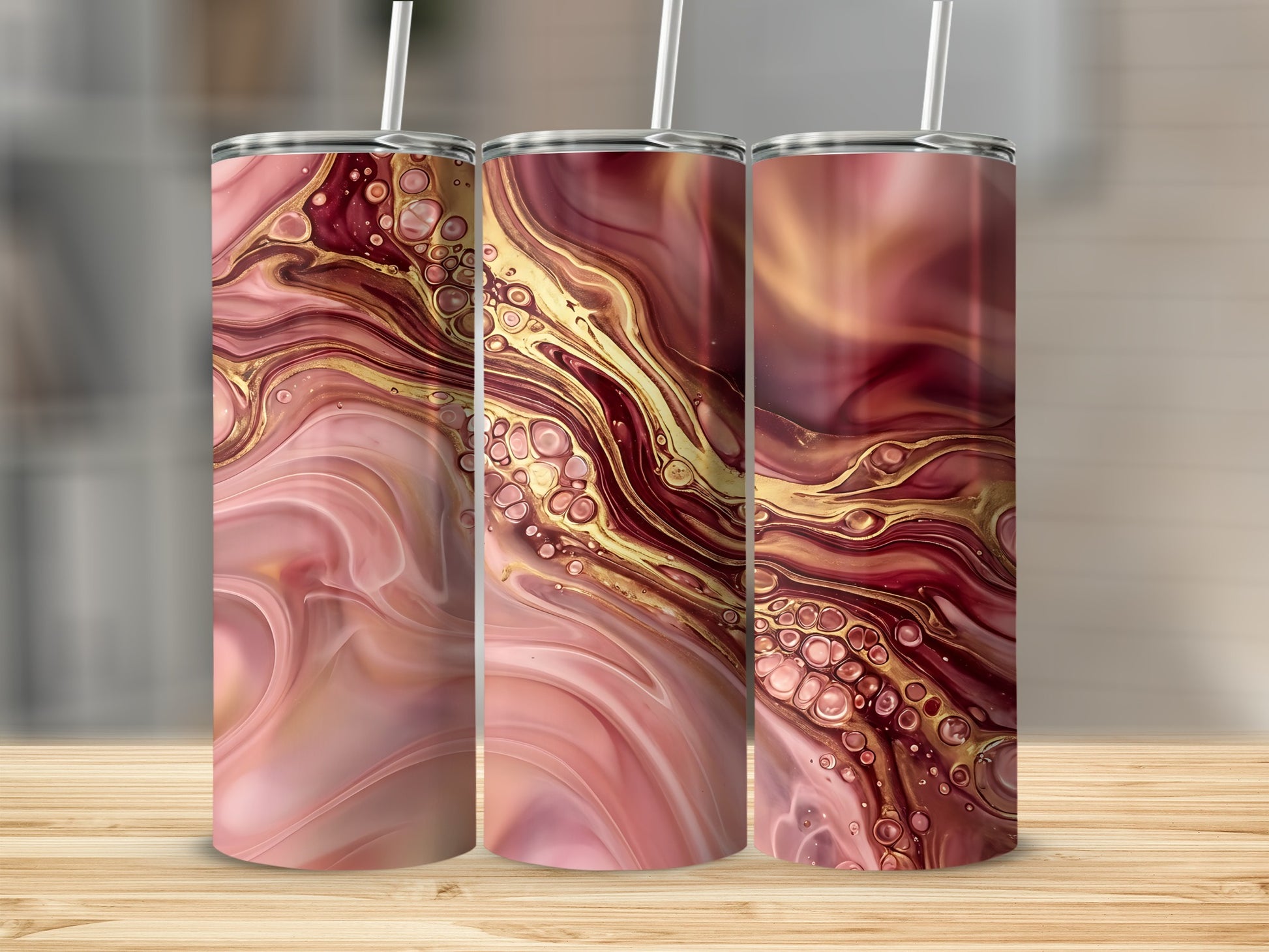 Three tumblers with pink, gold, and rose marbled abstract art.