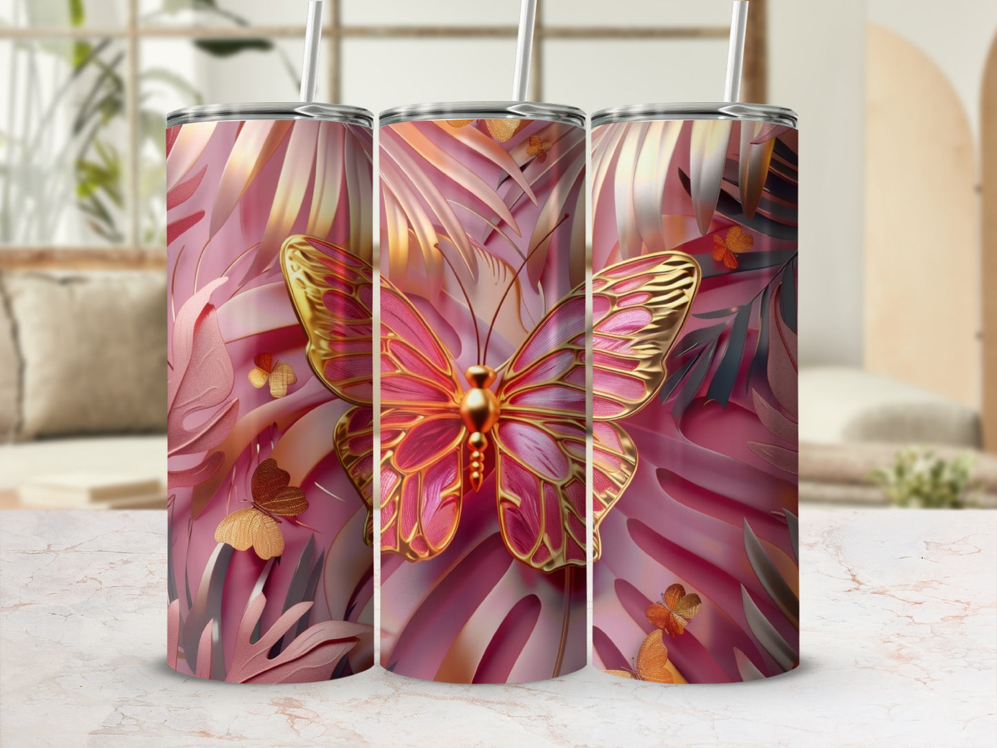 Pink and gold butterfly design on three tumblers with palm fronds.