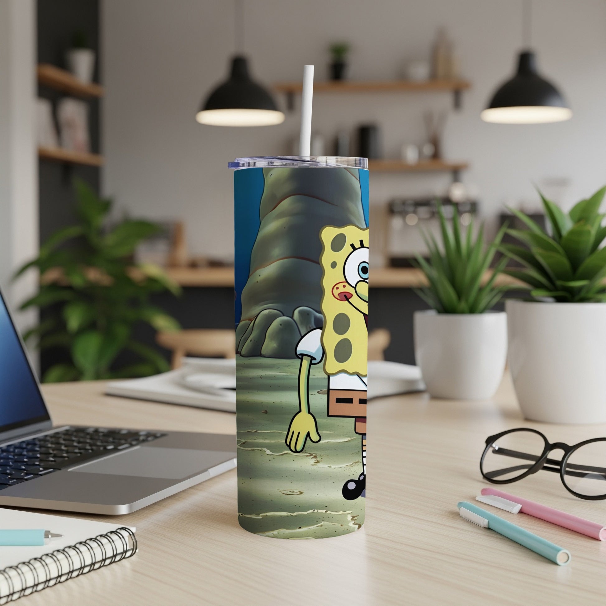 SpongeBob SquarePants character on a tumbler with a straw.