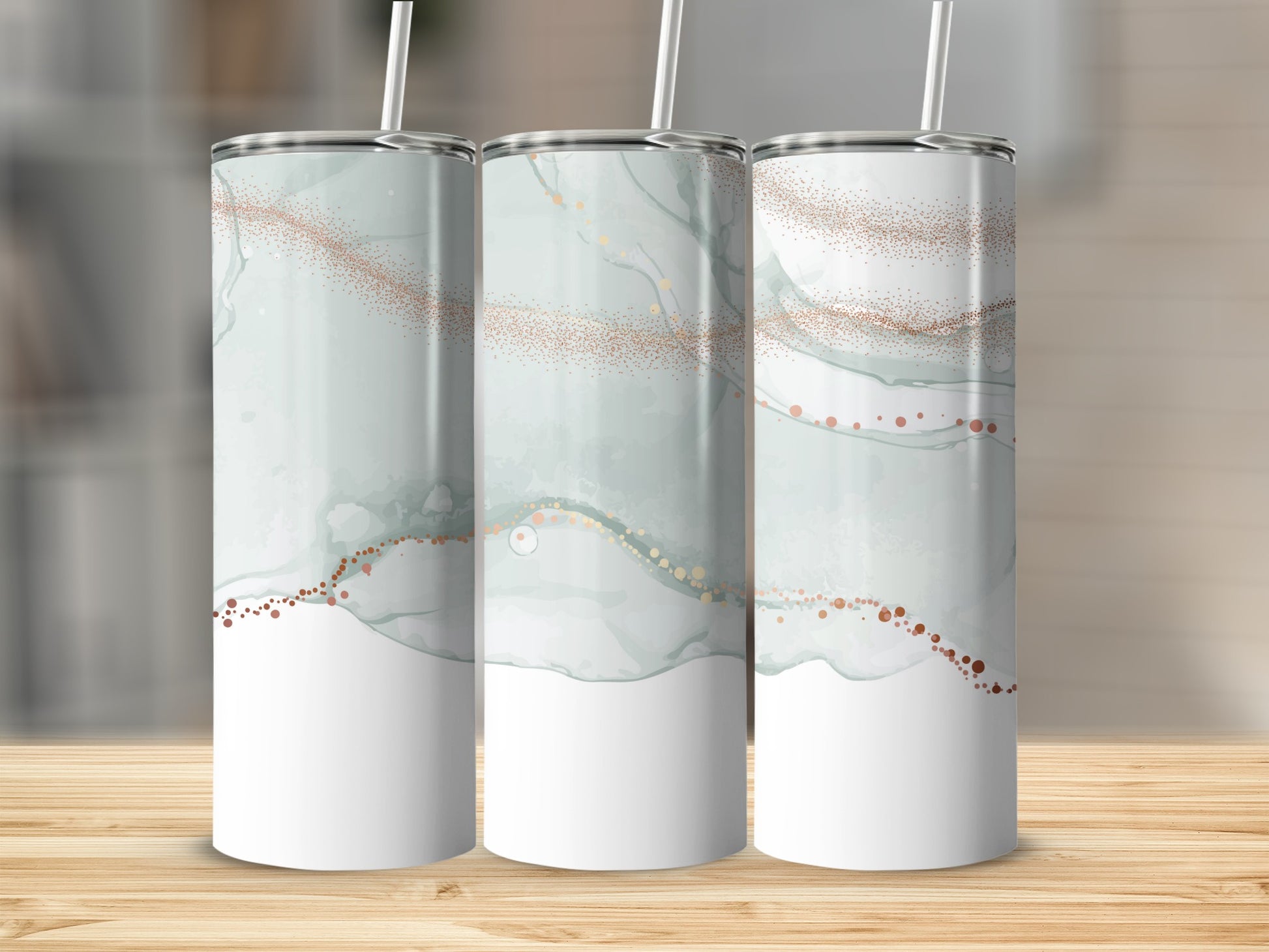 Three tall tumblers with abstract watercolor and glitter design.
