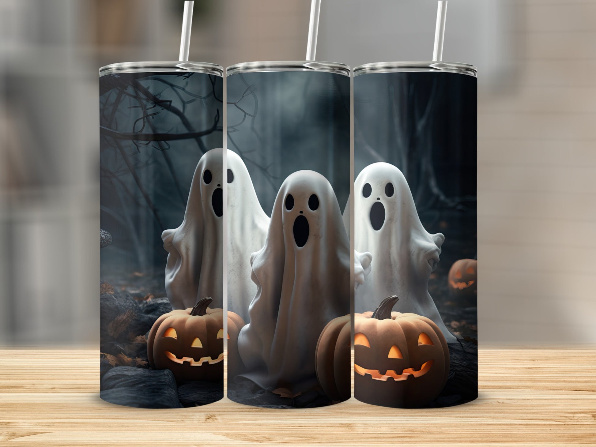 Three tumblers with a spooky Halloween design featuring ghosts and jack-o'-lanterns.