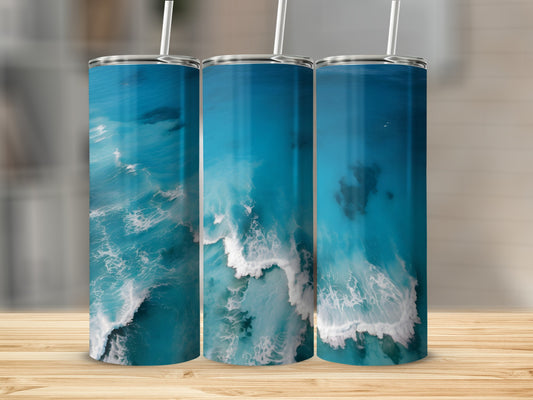 Three tumblers featuring a turquoise ocean wave pattern with white foam.