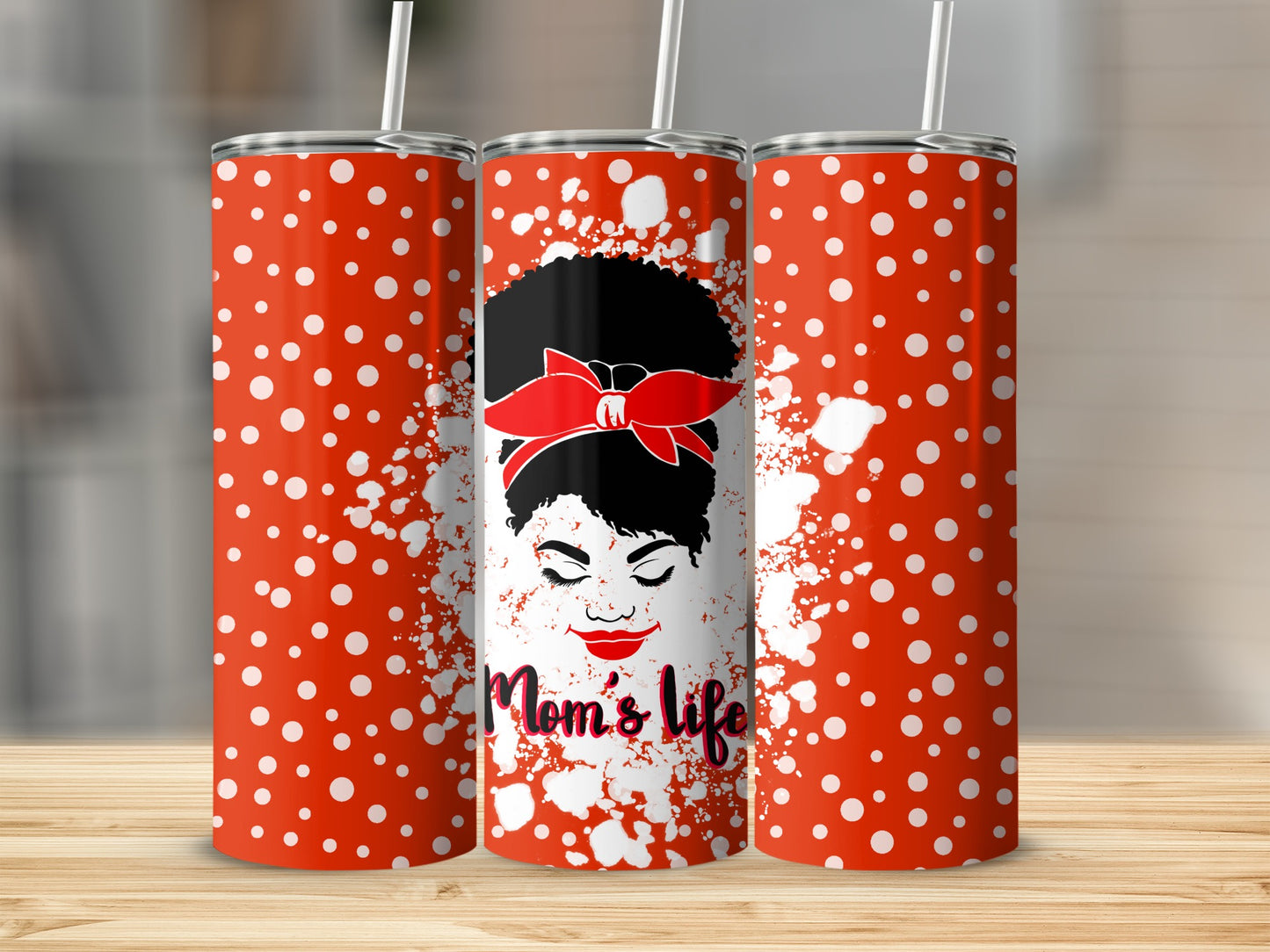 Red tumbler with white polka dots, featuring a woman with a red bandana and "Mom's life" text.