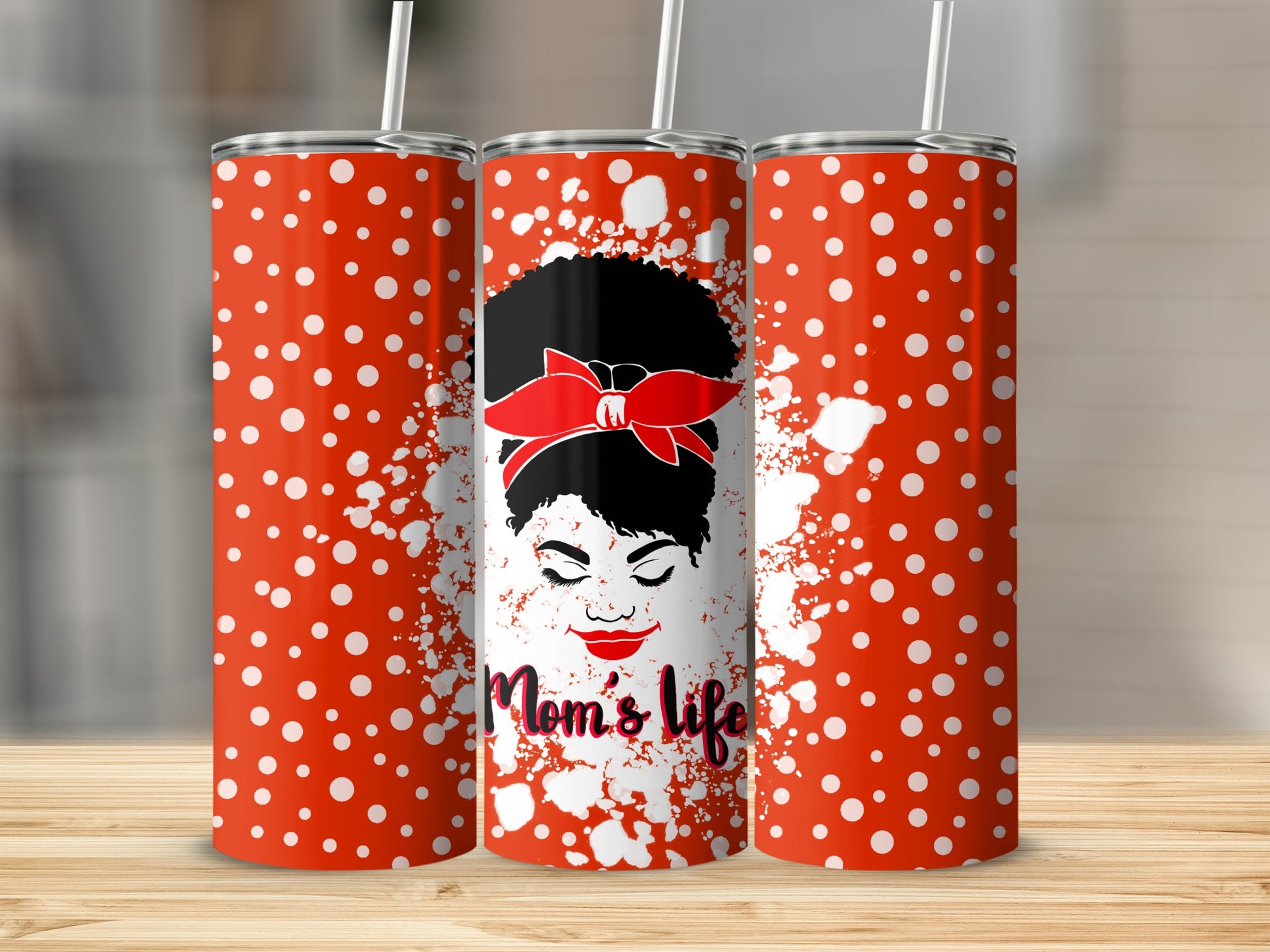 Red tumbler with white polka dots, featuring a woman with a red bandana and "Mom's life" text.