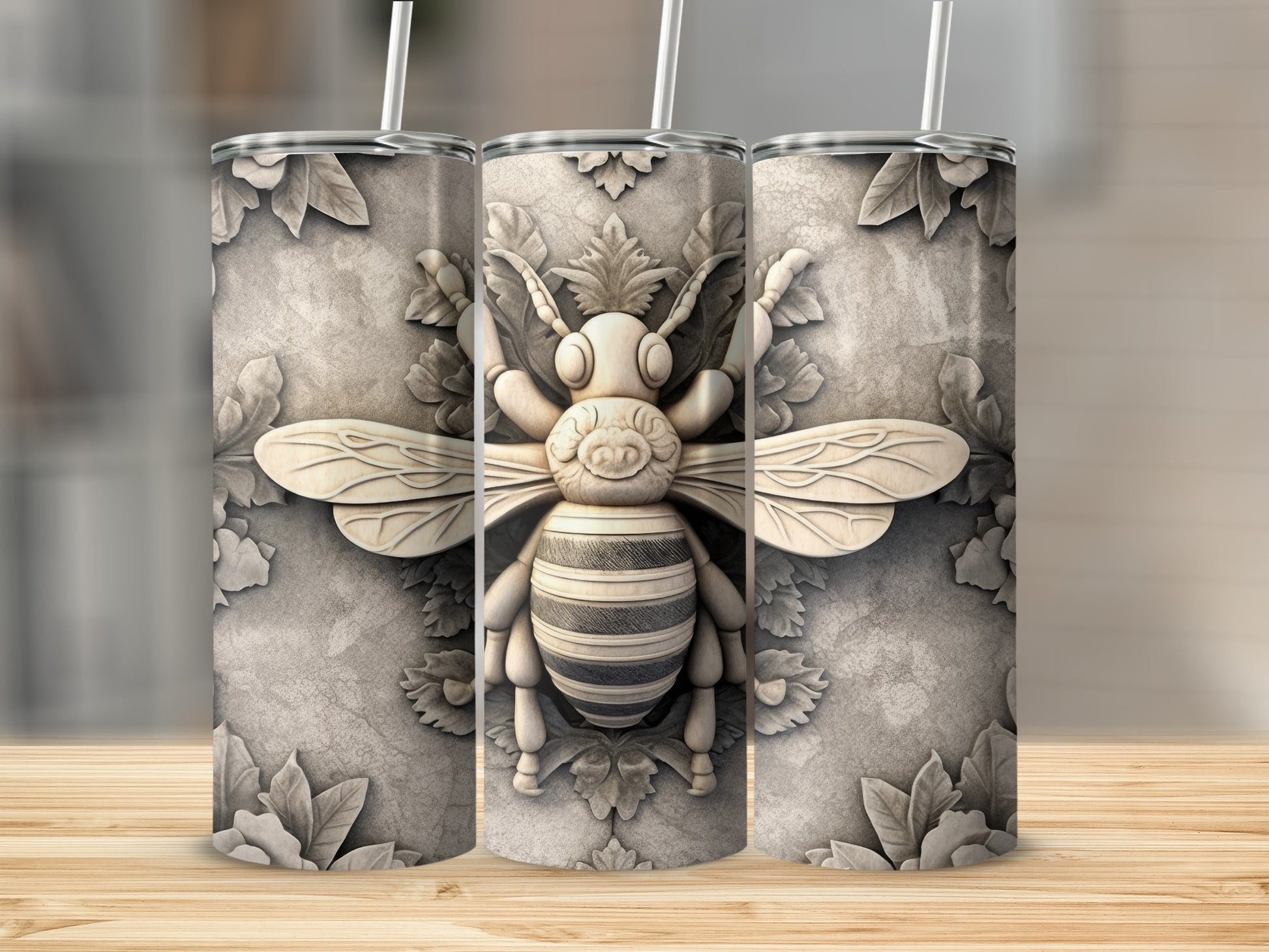 Three textured tumblers featuring a raised, ornate bee design on a stone-like background.