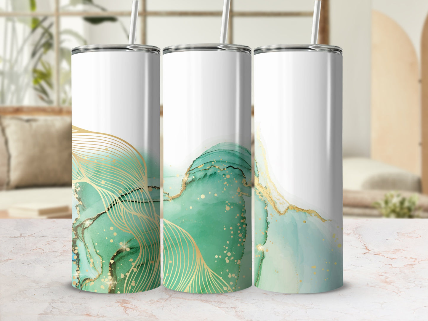 Three tumblers with green and gold abstract watercolor design and gold line accents.