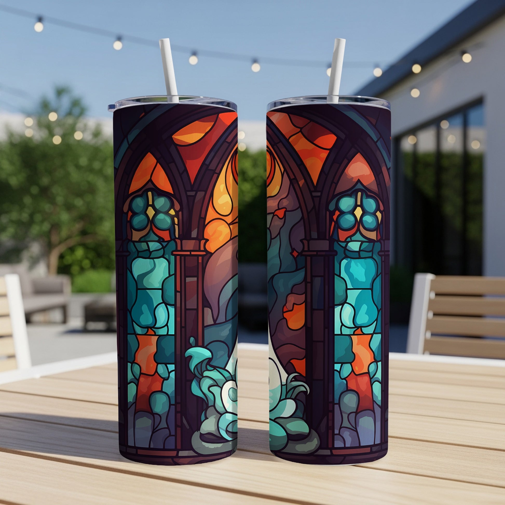 Two tumblers featuring stained-glass-style art with a celestial or angelic figure.