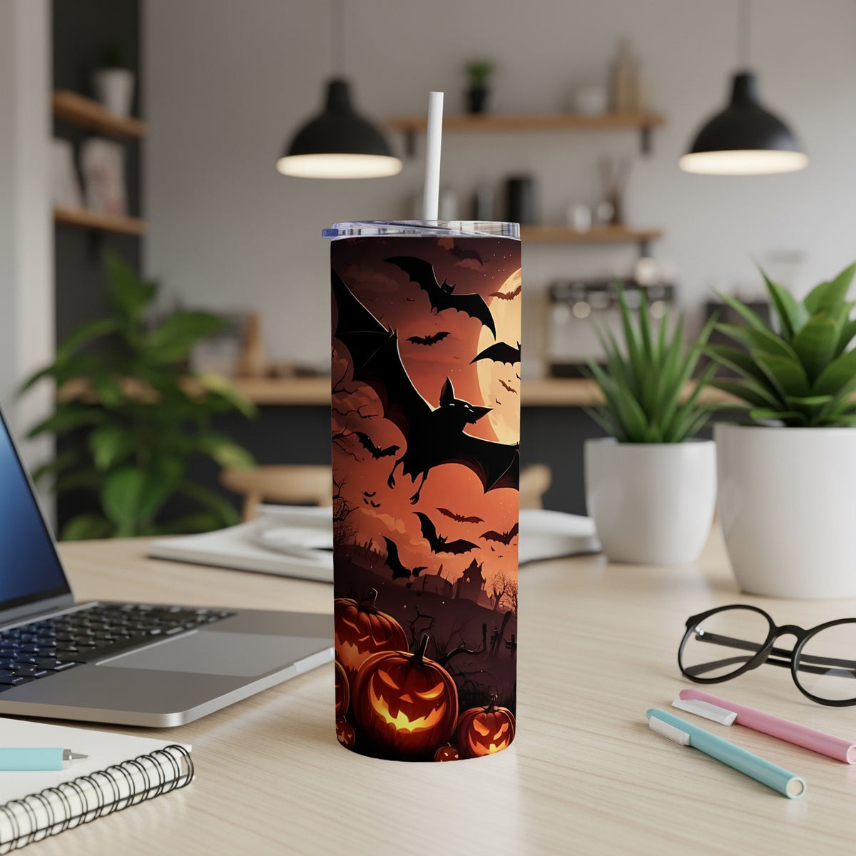 Halloween tumbler with bats, jack-o'-lanterns, and a spooky graveyard scene.