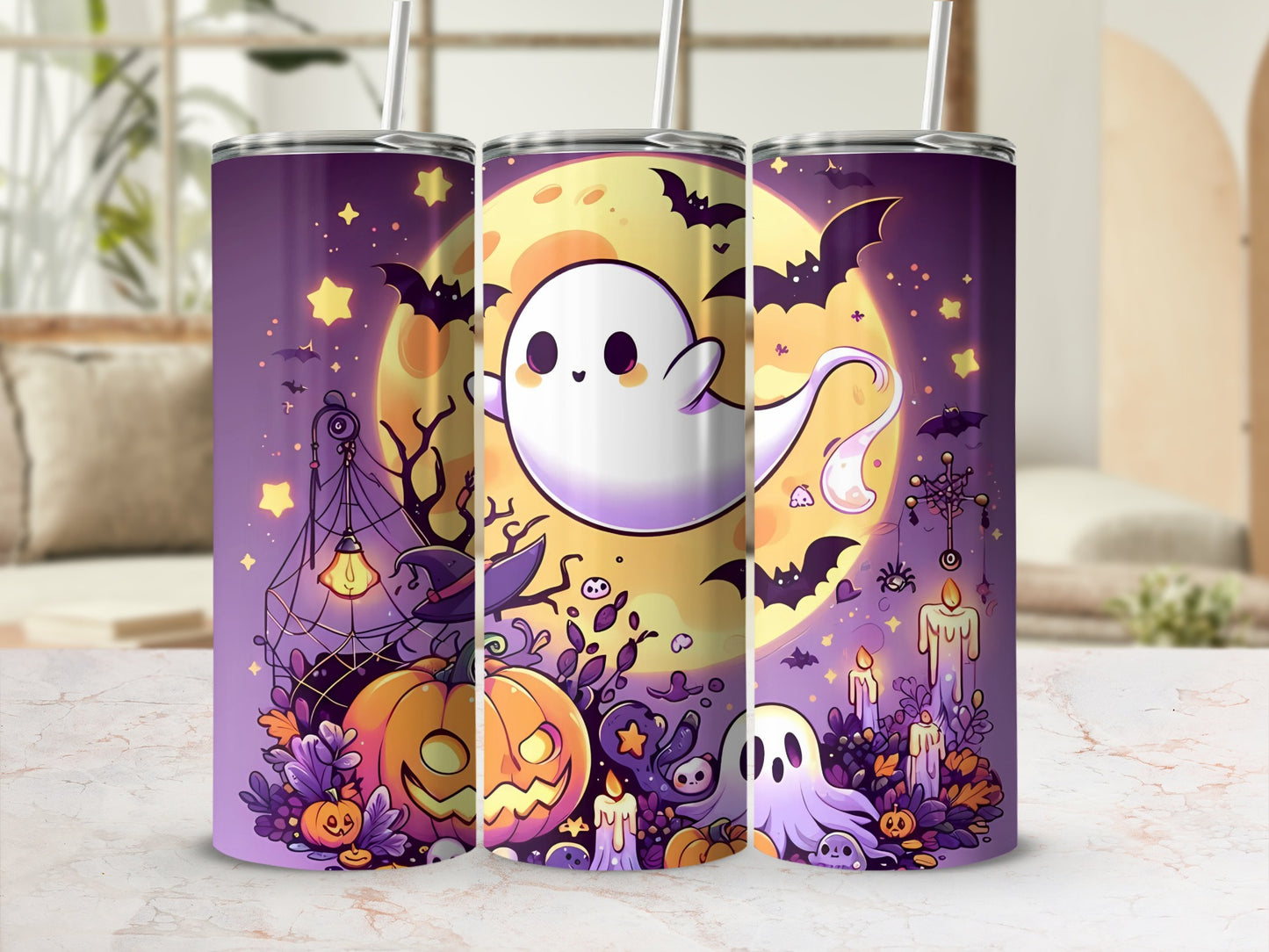 Three tumblers with Halloween graphics of ghosts, pumpkins, bats, and candles.