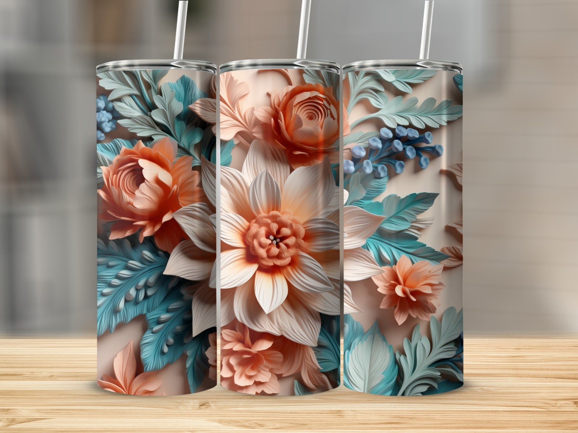Three tall, slim tumblers with ornate floral and leaf patterns.