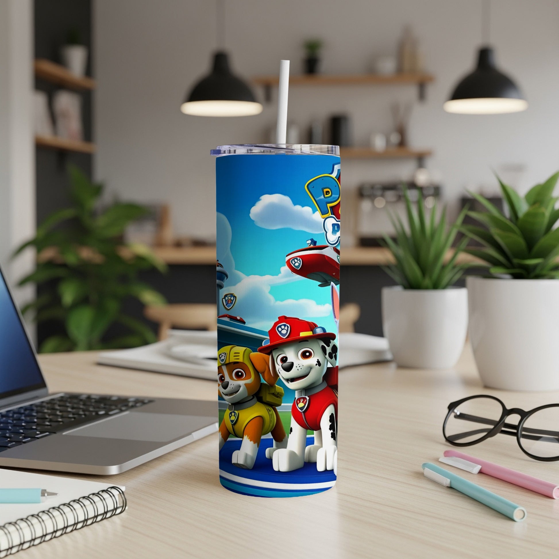 Paw Patrol characters Marshall and Chase on a blue tumbler with a white straw.