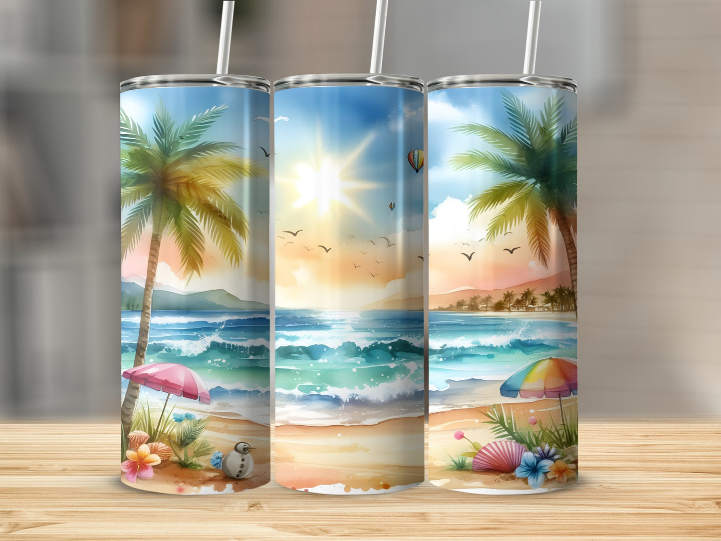 Beach scene with palm trees, sun, ocean, and colorful umbrellas on three tumblers.