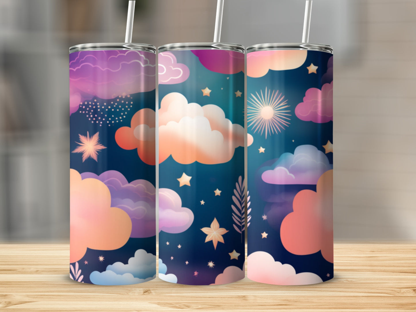 Three tumblers with a celestial cloud and star pattern in purple and pink hues.