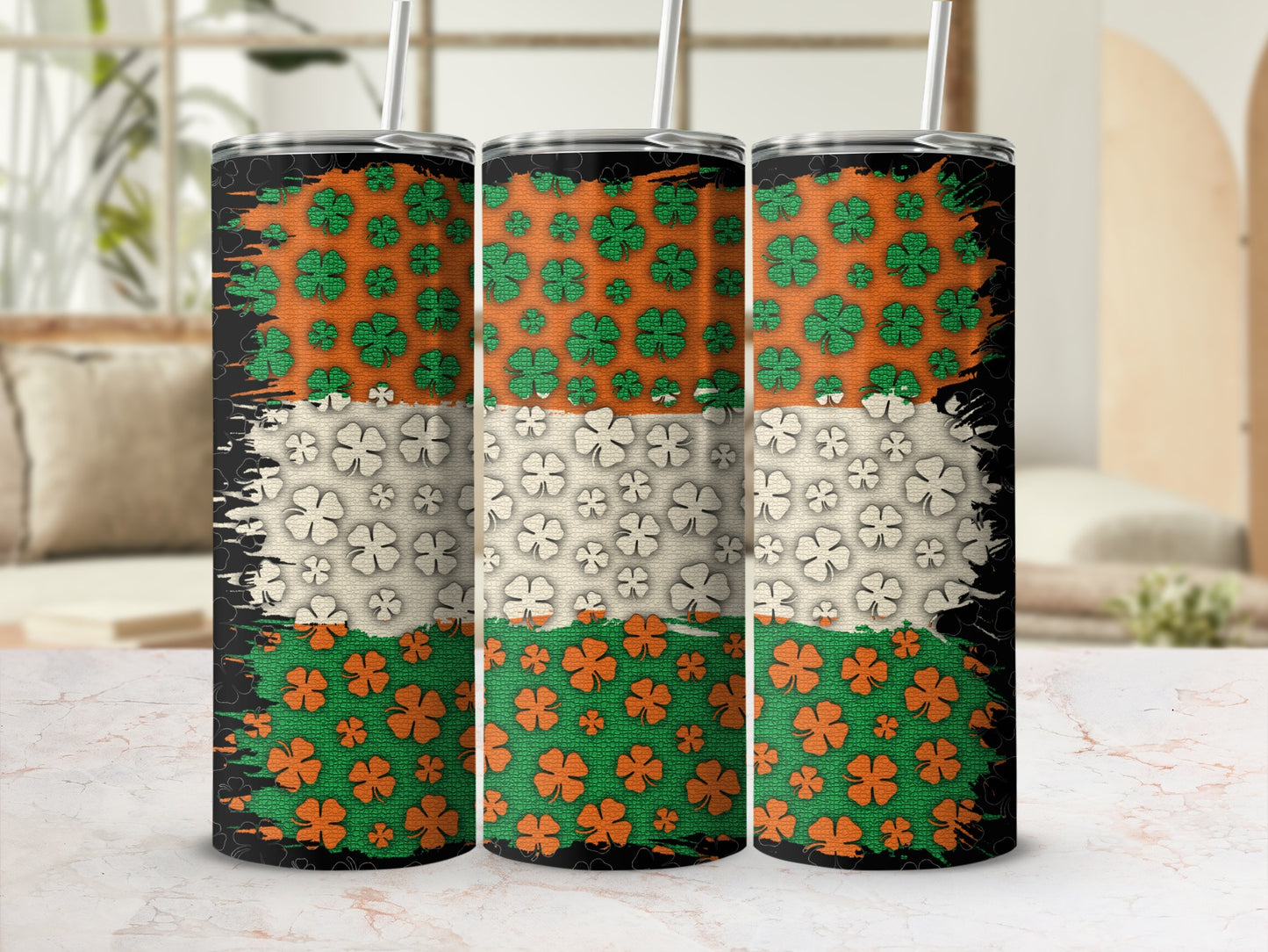 Three Saint Patrick's Day tumblers with shamrock patterns and distressed flag design.