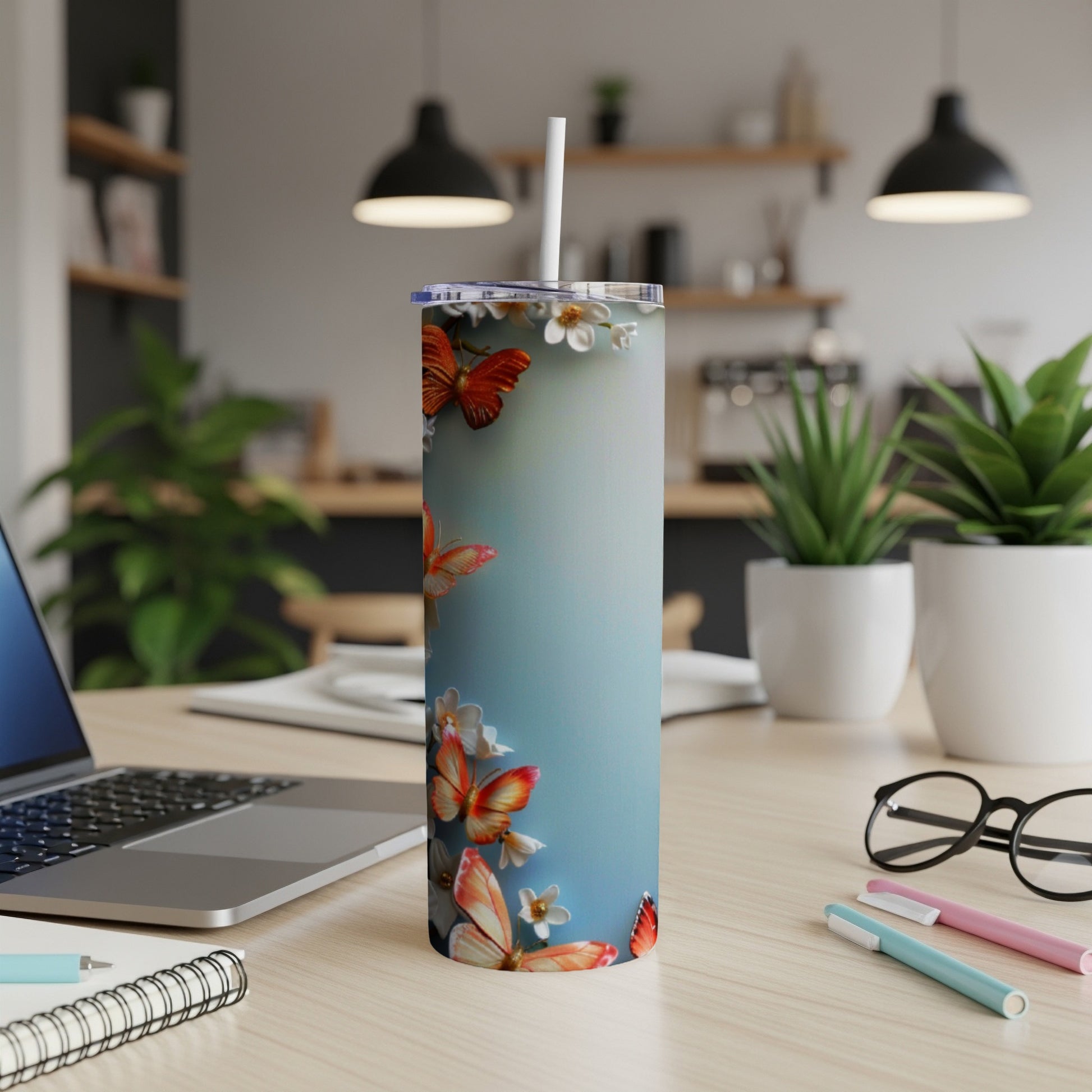 Tall tumbler with butterflies and flowers design.