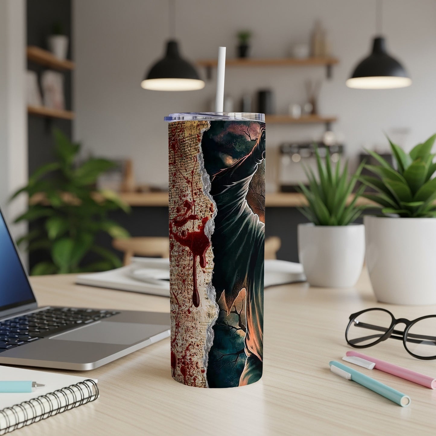Tumbler with ripped paper, blood spatter, and a hooded figure design.