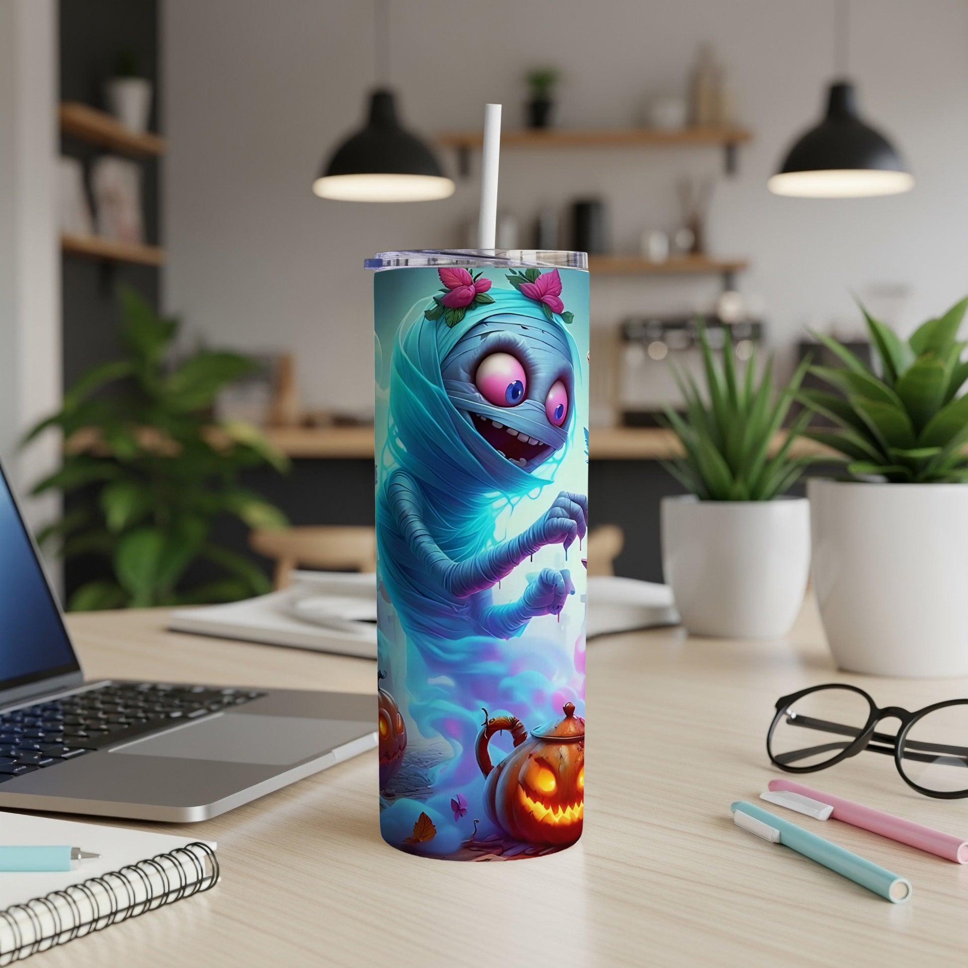 Tumbler with a cartoon mummy and spooky pumpkins design.